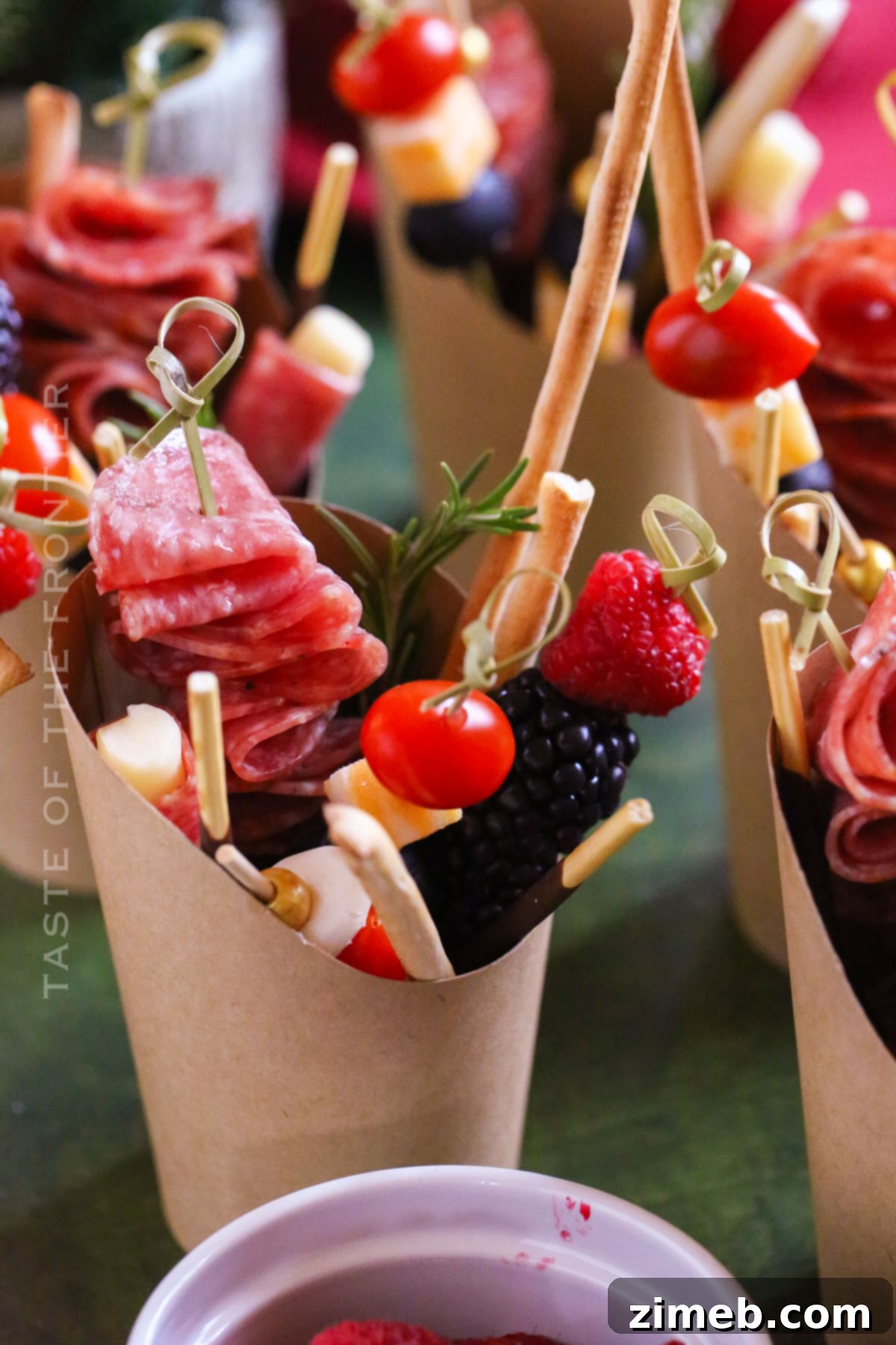 Snack cups filled with various charcuterie items