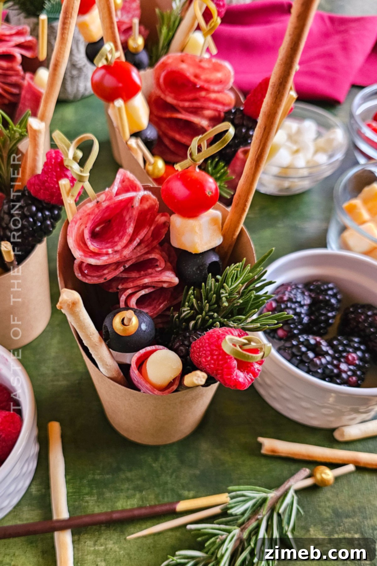 Assembling snack cups with various ingredients