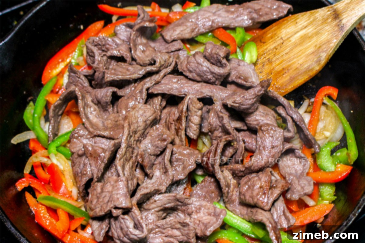 Bold Black Bean Beef 6 tossing in the sauce