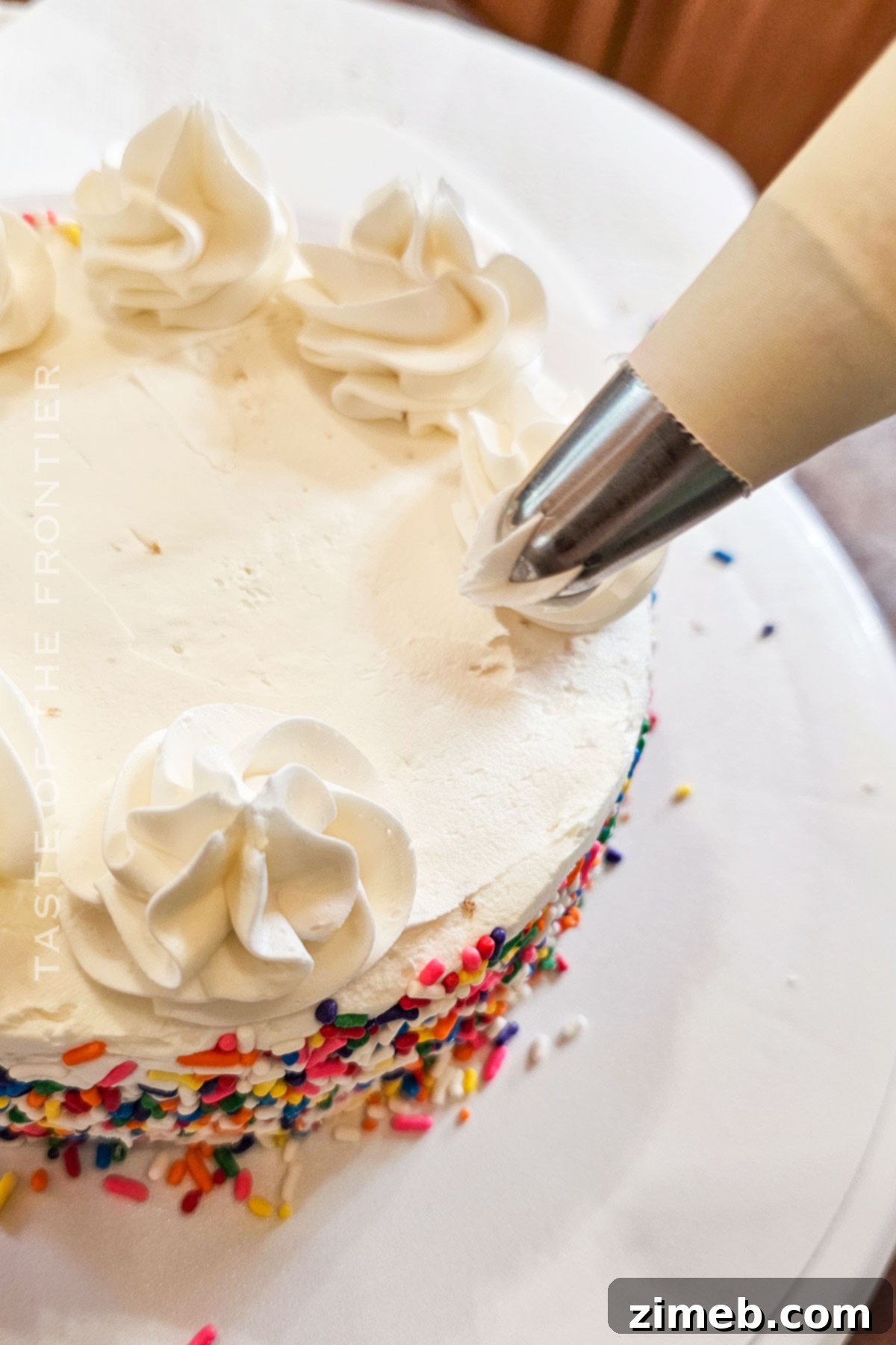 Petite Birthday Delight 8 piping the frosting
