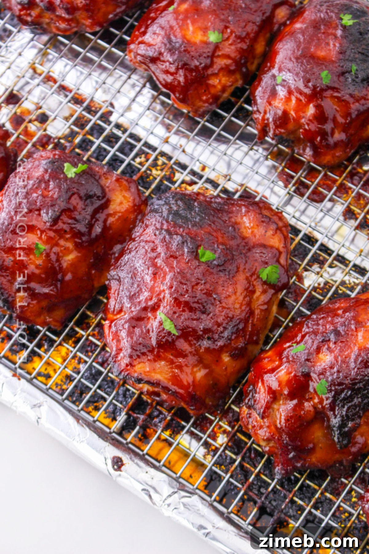 Oven Baked BBQ Chicken Thighs 14 Oven Chicken Thighs BBQ Recipe Card - A beautifully plated dish of barbecue chicken thighs.