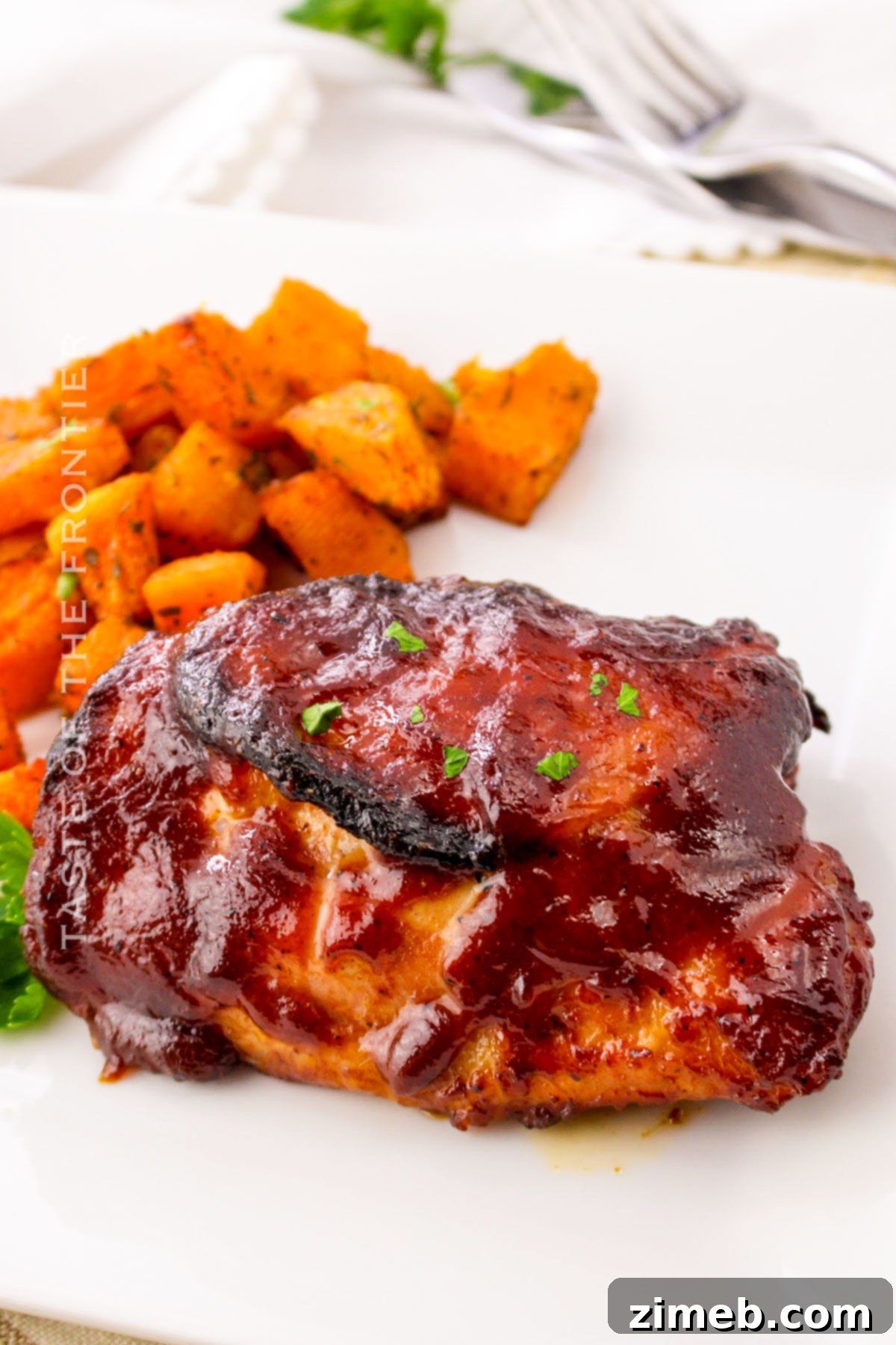 Oven Baked BBQ Chicken Thighs 7 A complete chicken dinner, baked in the oven with BBQ sauce, served with delicious sides.