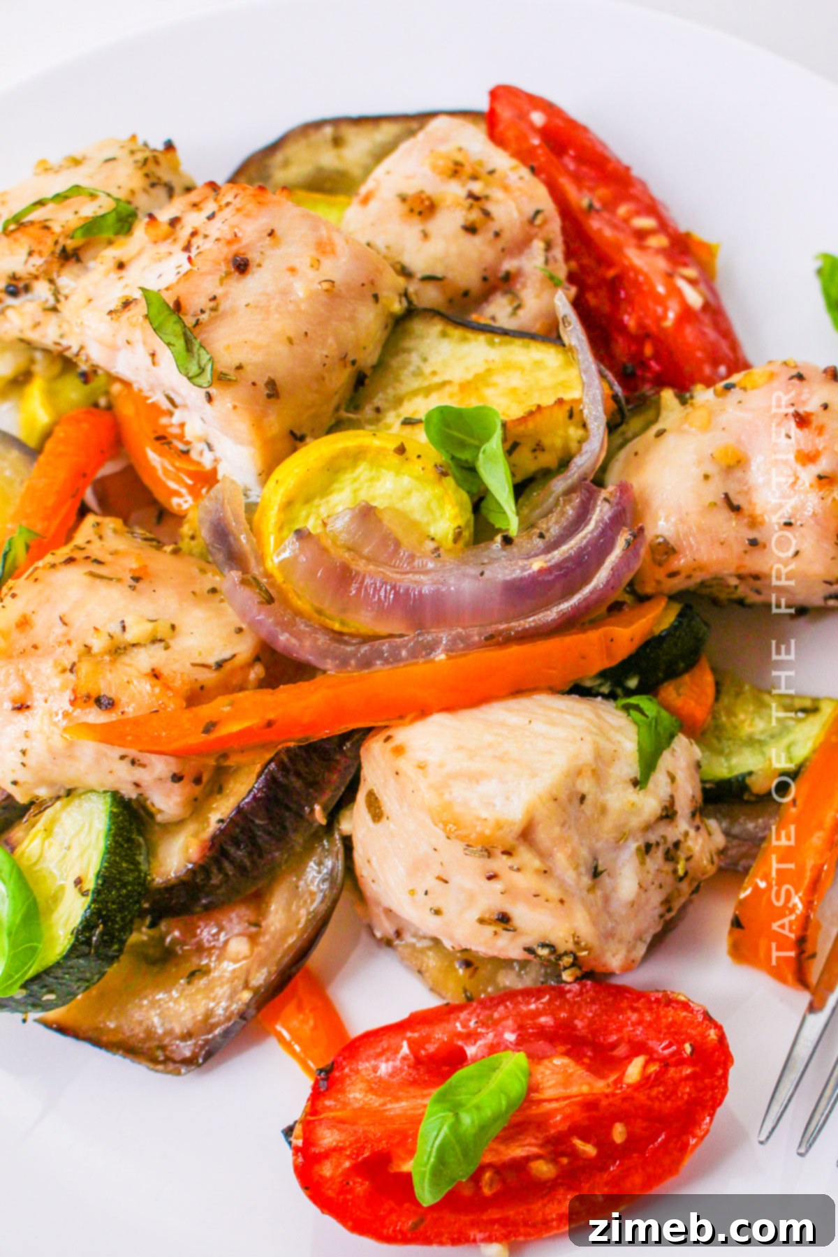 Close-up of a serving of Sheet Pan Chicken Ratatouille recipe