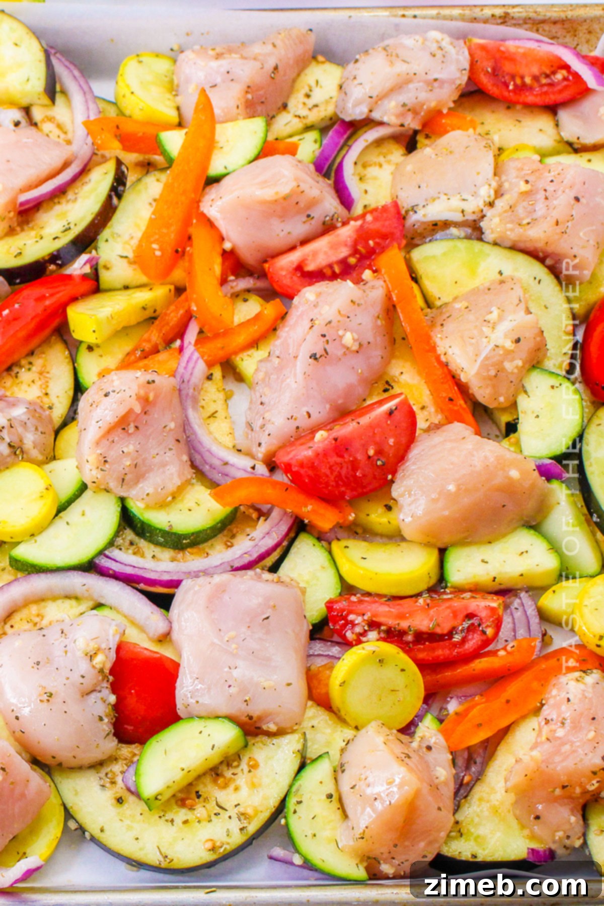 Sheet Pan Chicken Ratatouille cooking in the oven