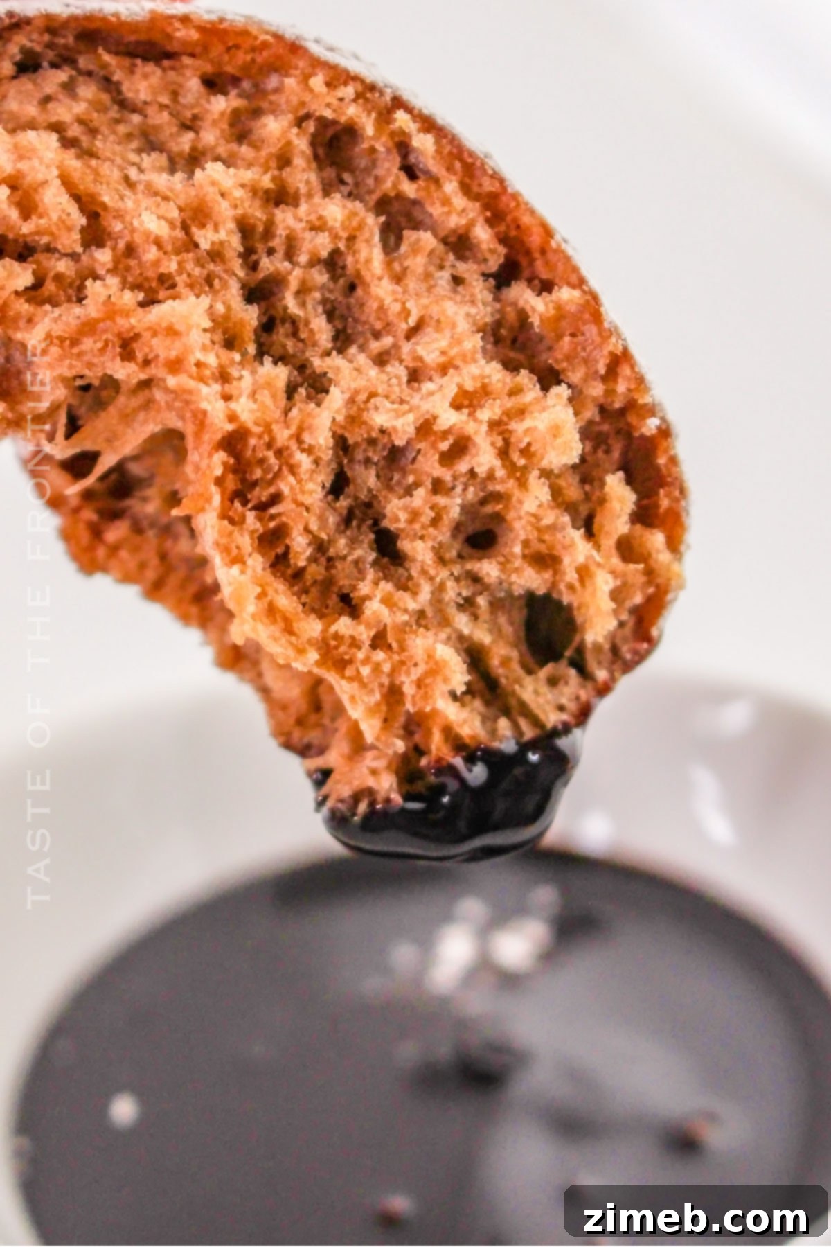 Chocolate beignets with some dipped in chocolate sauce for extra indulgence
