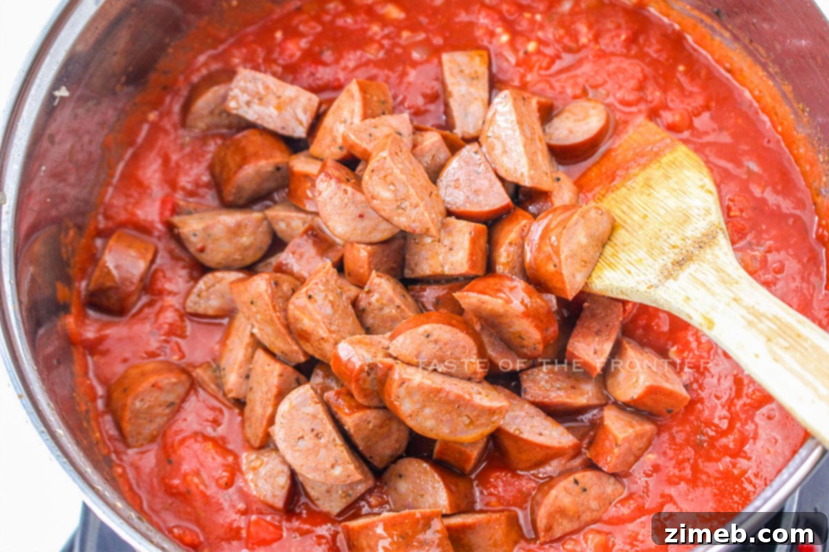 Smoky Cajun Sausage Pasta 6 adding the sausage