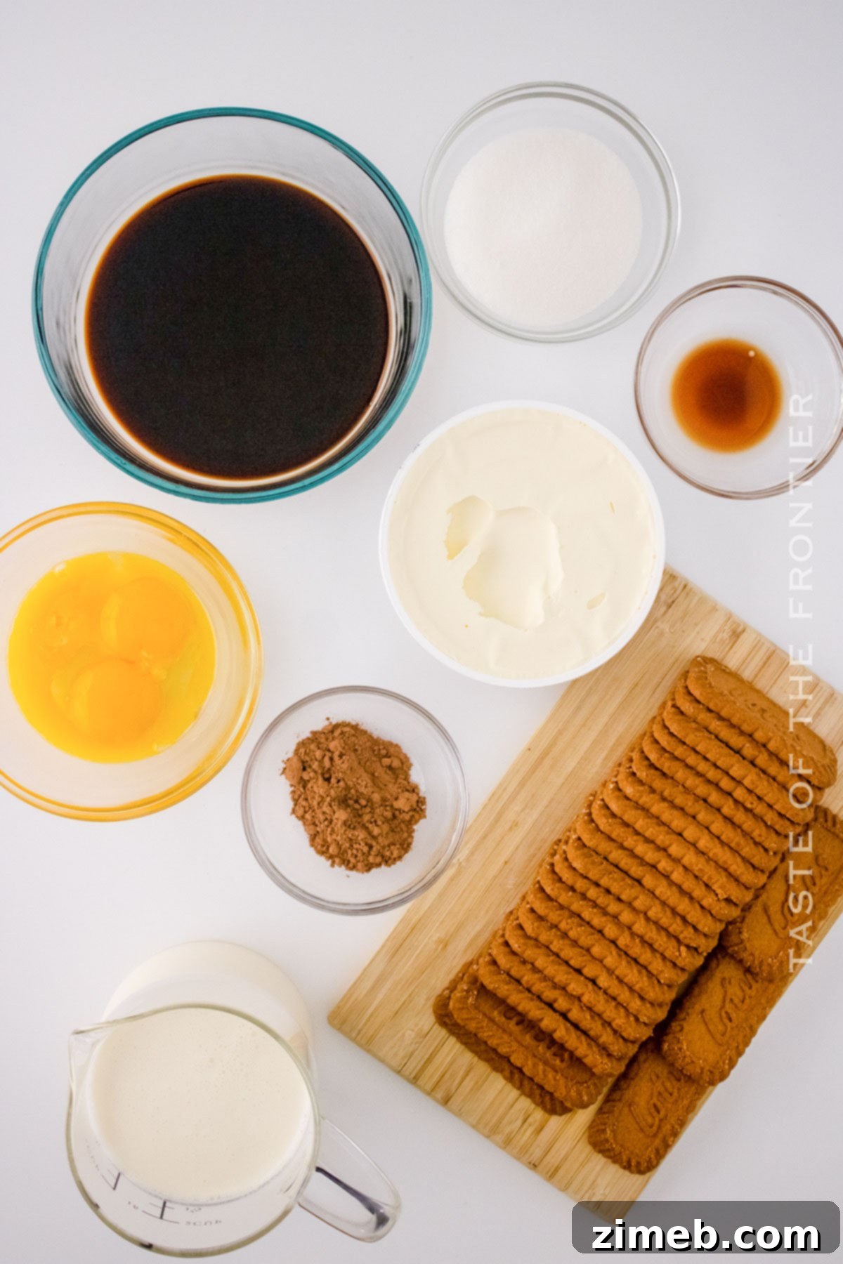 Spiced Biscoff Tiramisu 4 Ingredients for making Biscoff Tiramisu laid out on a table
