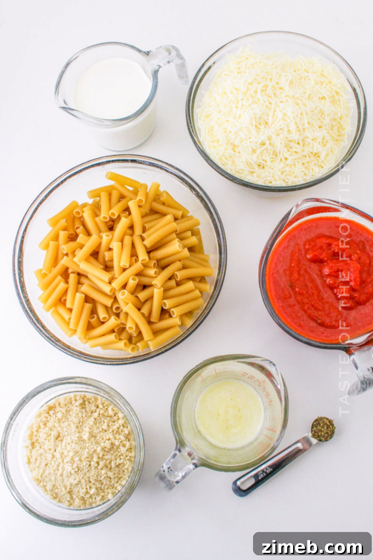 Ingredients for Five Cheese Ziti al Forno including pasta, marinara, cream, and cheese