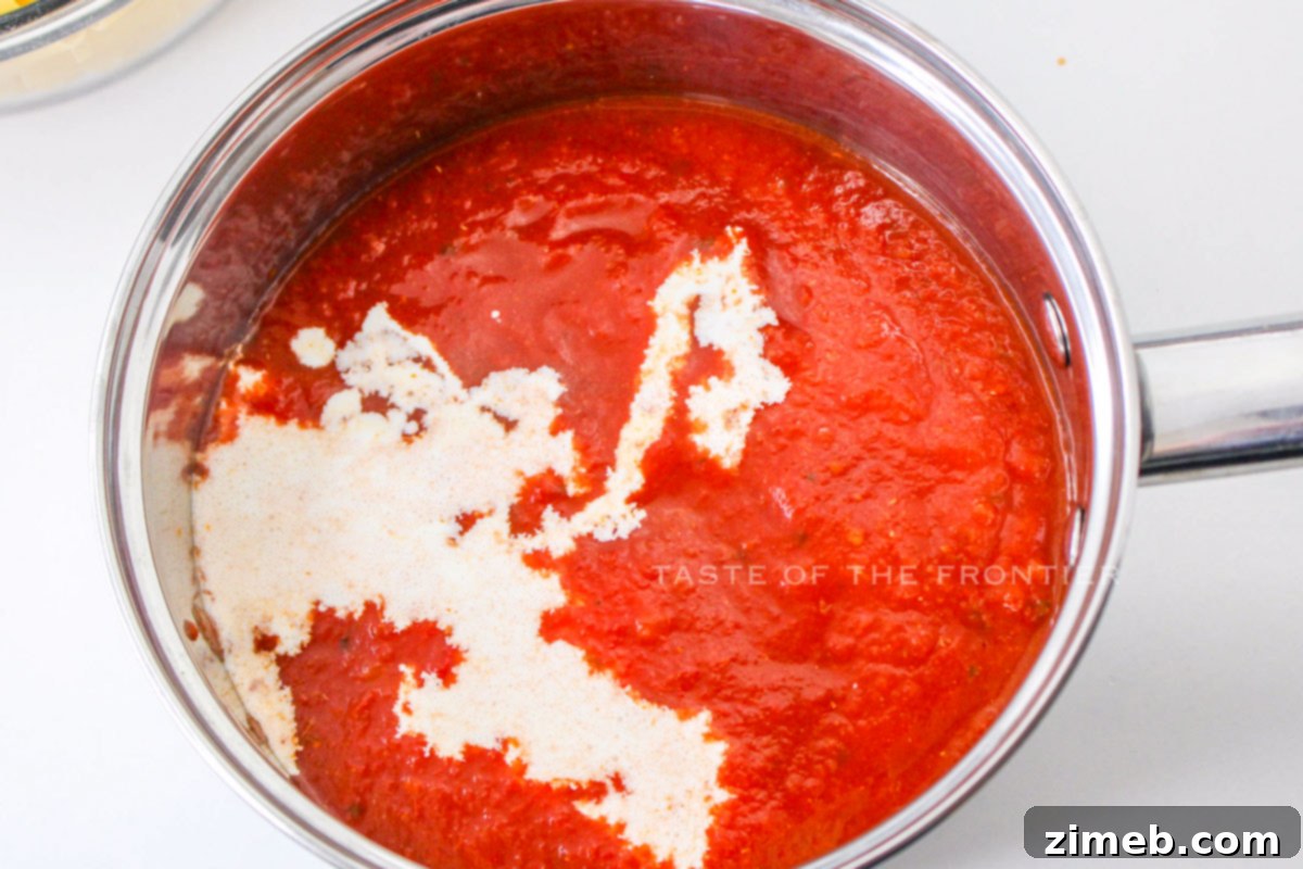 Making the cheese marinara sauce for Five Cheese Ziti al Forno