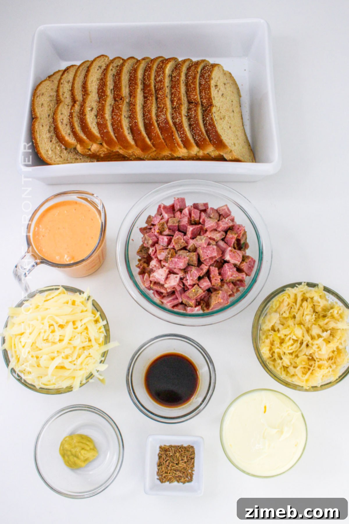 Reuben Casserole Ingredients - Essential components like corned beef, sauerkraut, Swiss cheese, and dressing ready for assembly.
