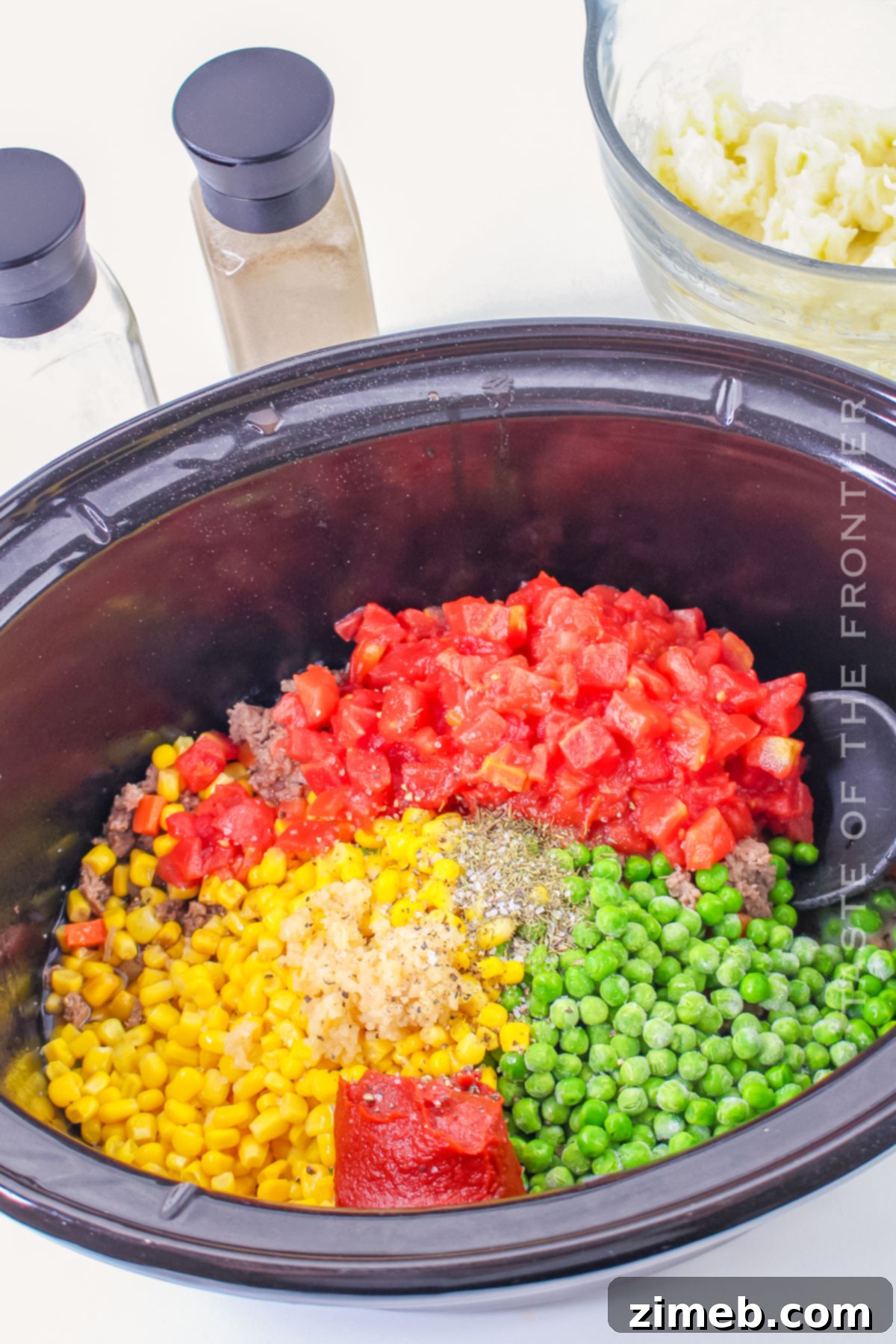 Slow Cooker Shepherd's Pie 5 Steps on how to make Crock Pot Shepherd's Pie, showcasing the meat and vegetable layer.