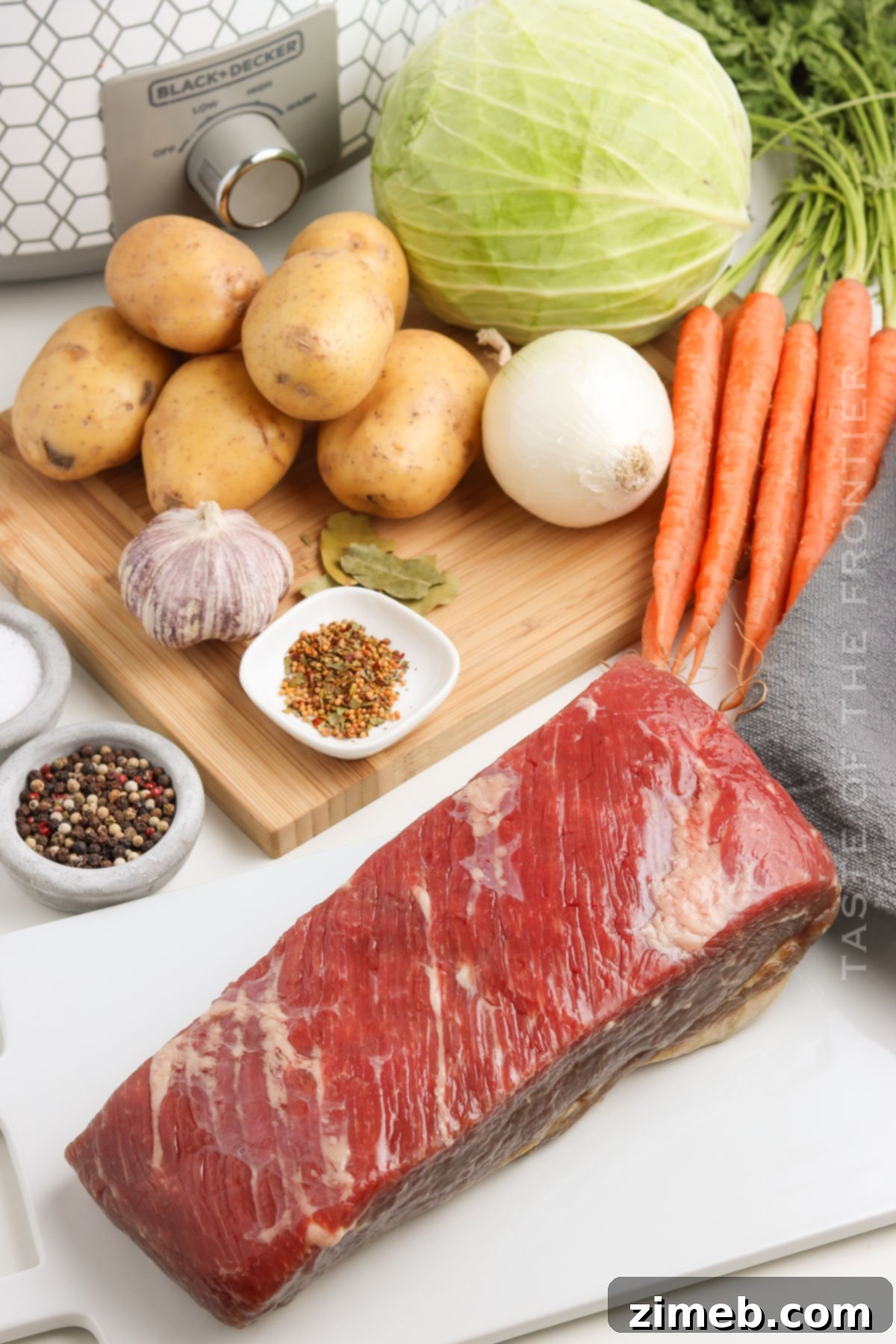 Fresh ingredients laid out for Slow Cooker Corned Beef and Cabbage.