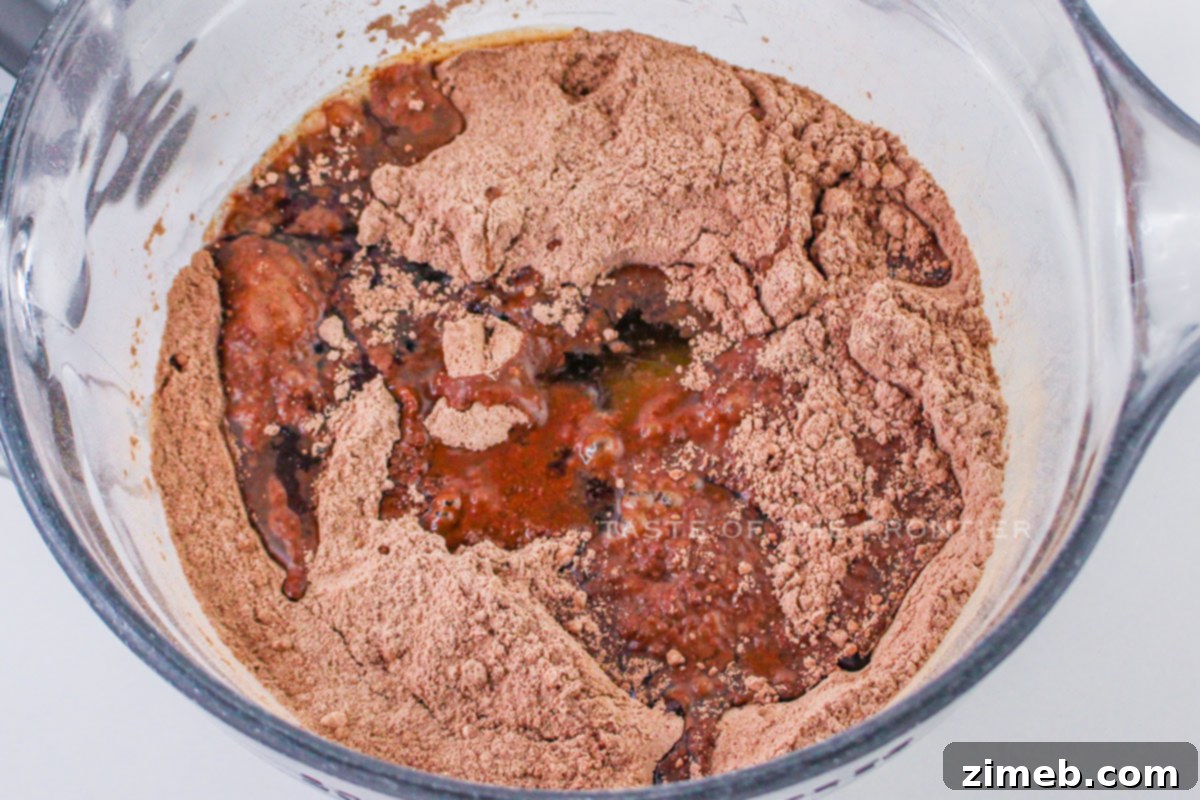 Smooth chocolate cake batter ready to bake