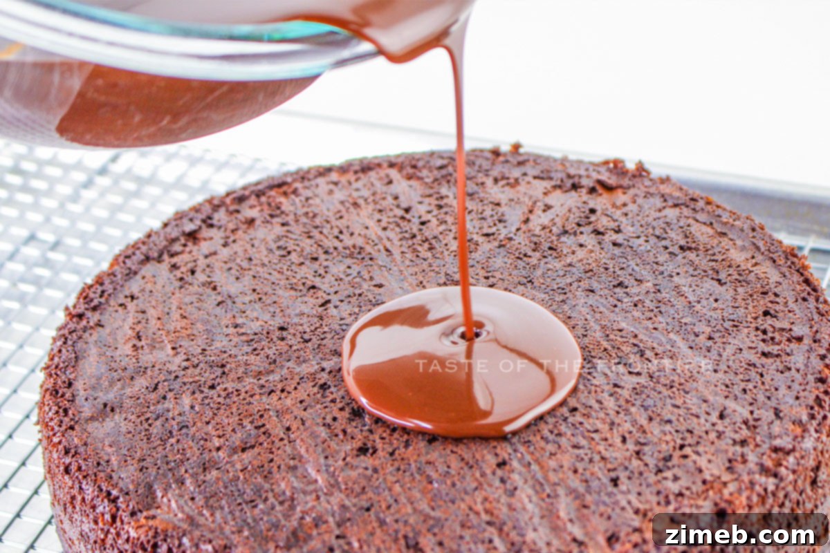 Rich chocolate fudge glaze on cake