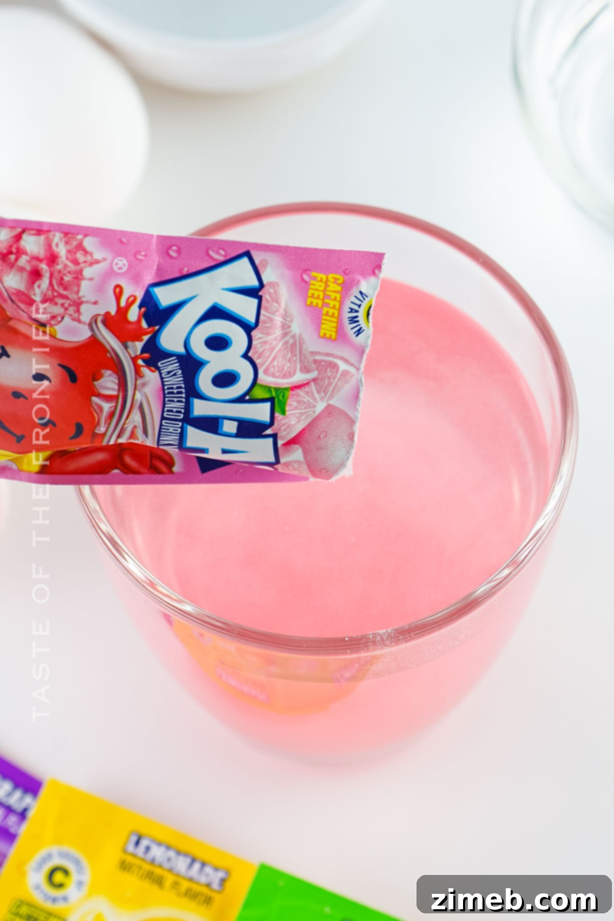 Vibrant Kool-Aid Eggs 5 making pink eggs