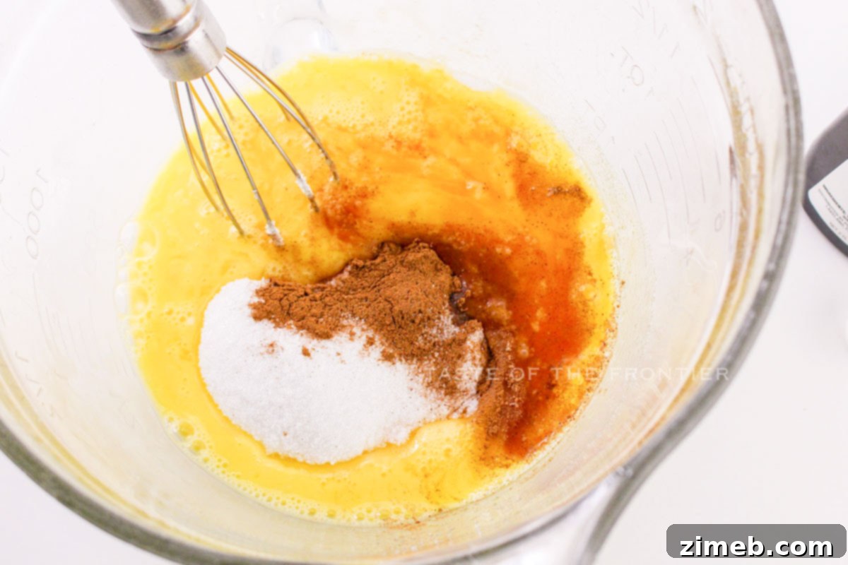 Close-up of egg batter or custard mixture being prepared in a bowl.
