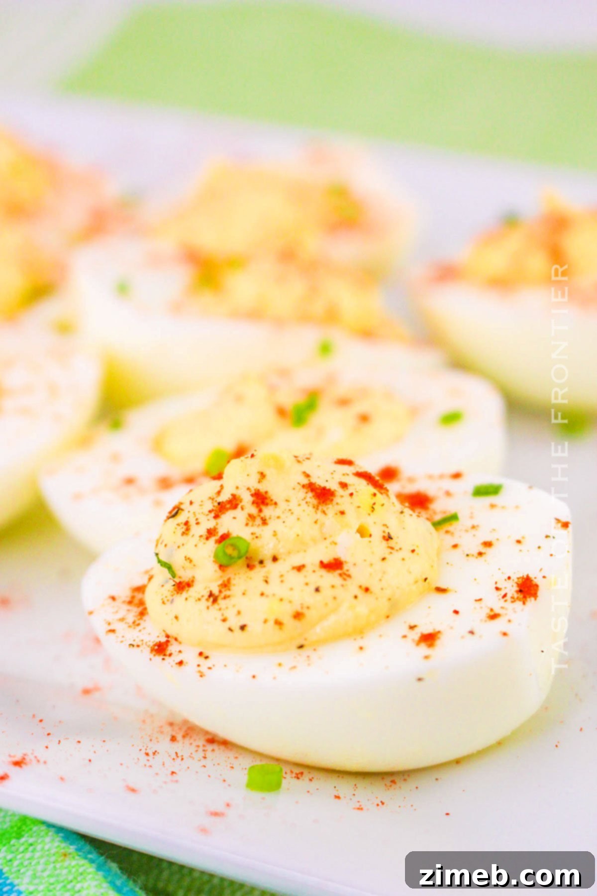 Decadent Deviled Eggs 2 Million Dollar Deviled Eggs with paprika and chives garnish