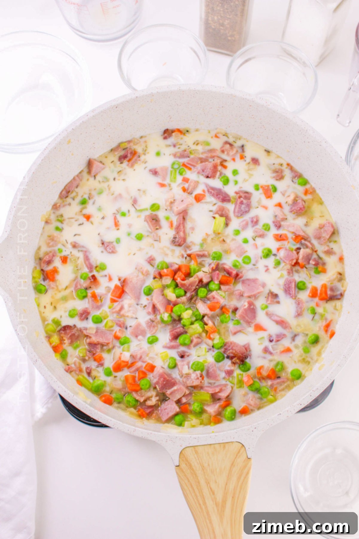 Making the ham pot pie filling with diced ham