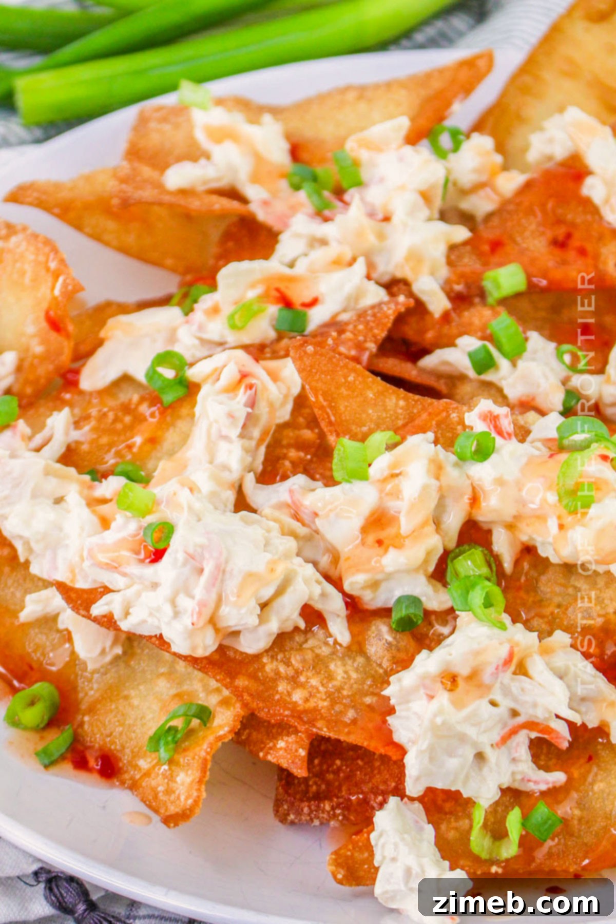Crispy Rangoon Crab Nachos 16 Completed Crab Rangoon Nacho recipe on a platter