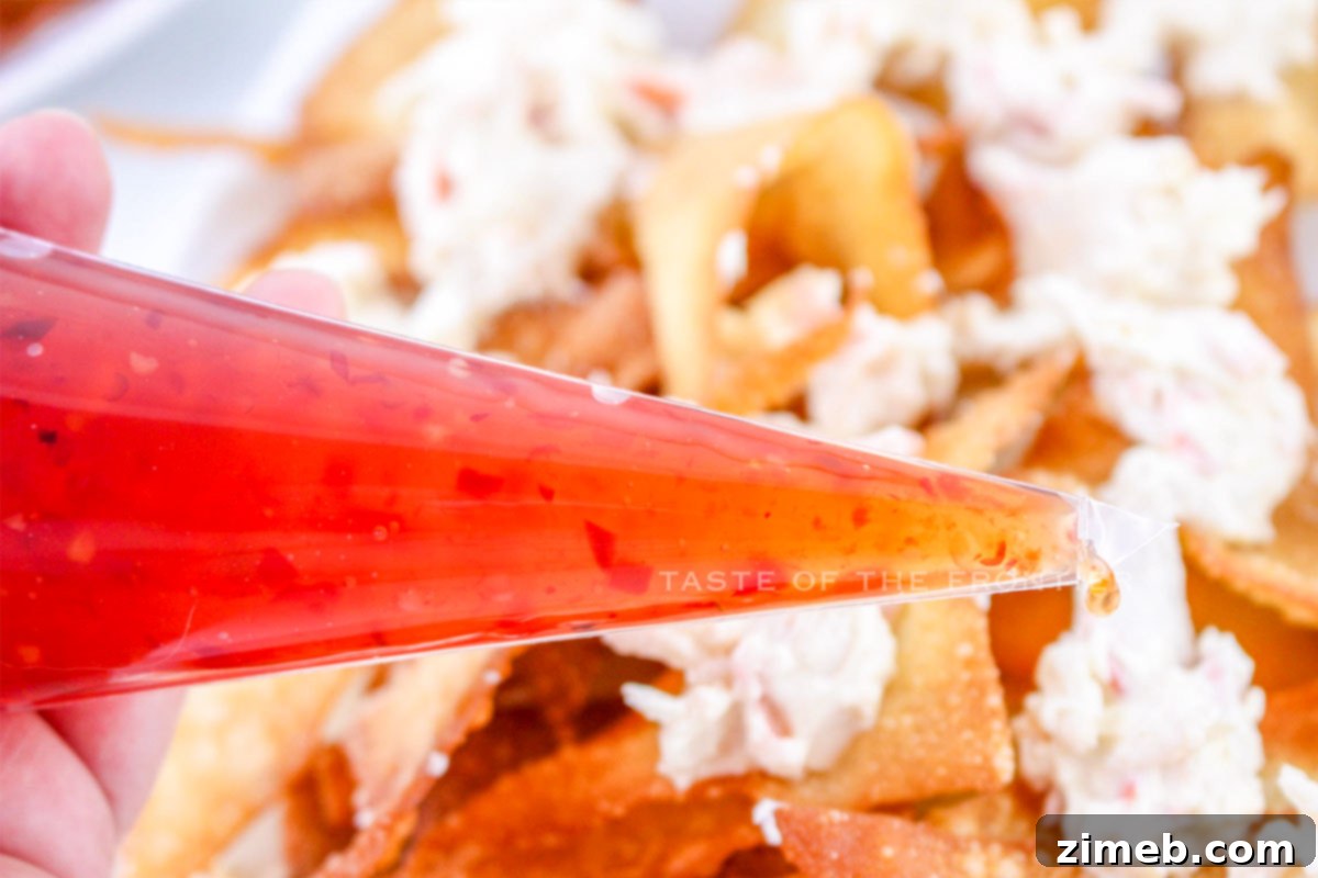 Crispy Rangoon Crab Nachos 9 Sweet chili sauce drizzled over nachos
