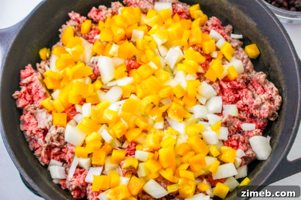 Fiesta Beef and Rice Skillet 5 Sautéing beef and peppers for Mexican Beef and Rice Skillet