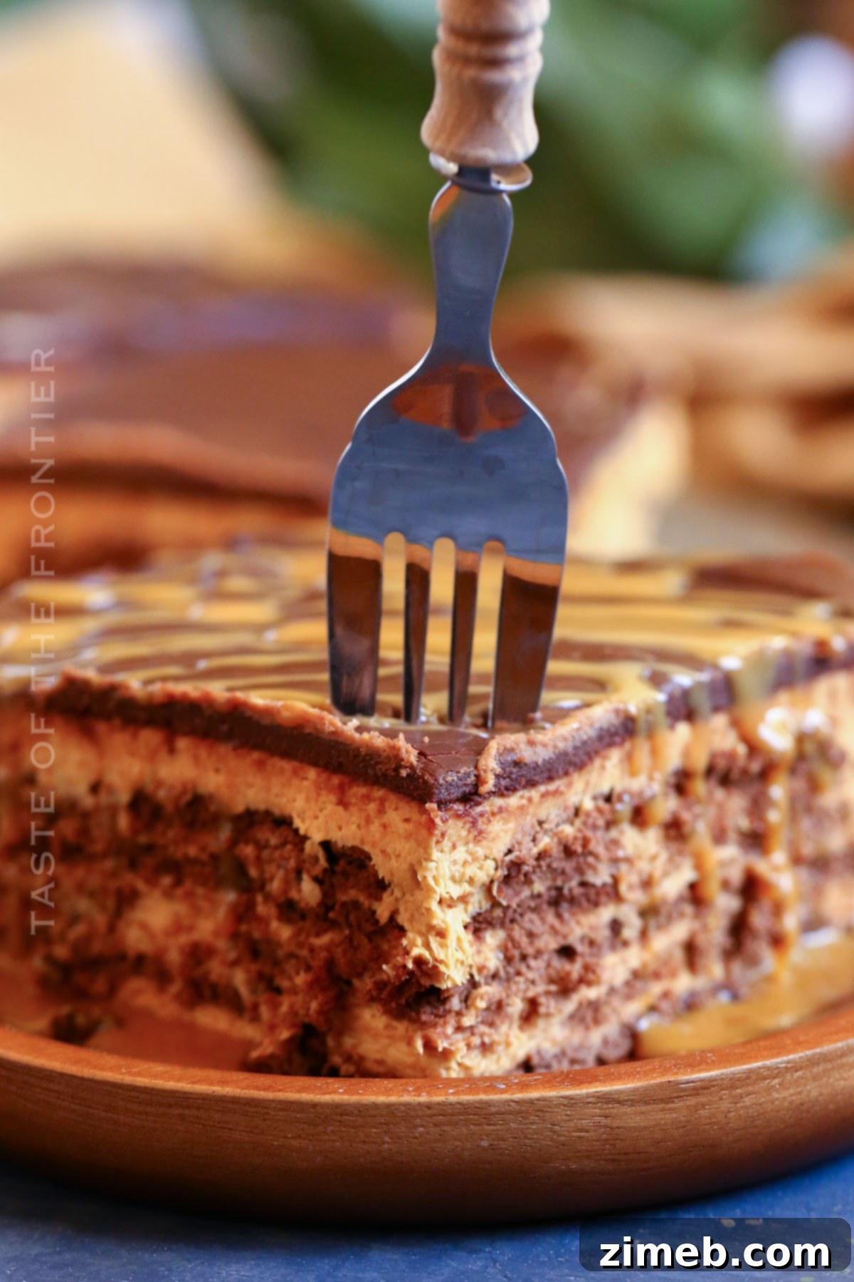 Delicious no-bake dulce de leche dessert with chocolate cookies and cream cheese filling.