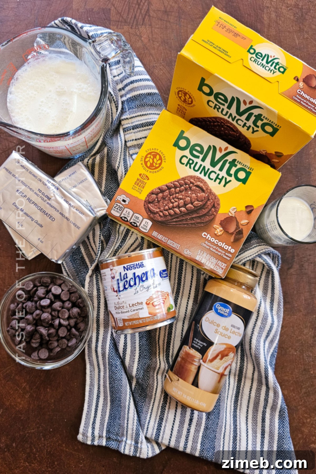Fresh ingredients for homemade Chocotorta, including chocolate cookies, dulce de leche, cream cheese, and chocolate chips.