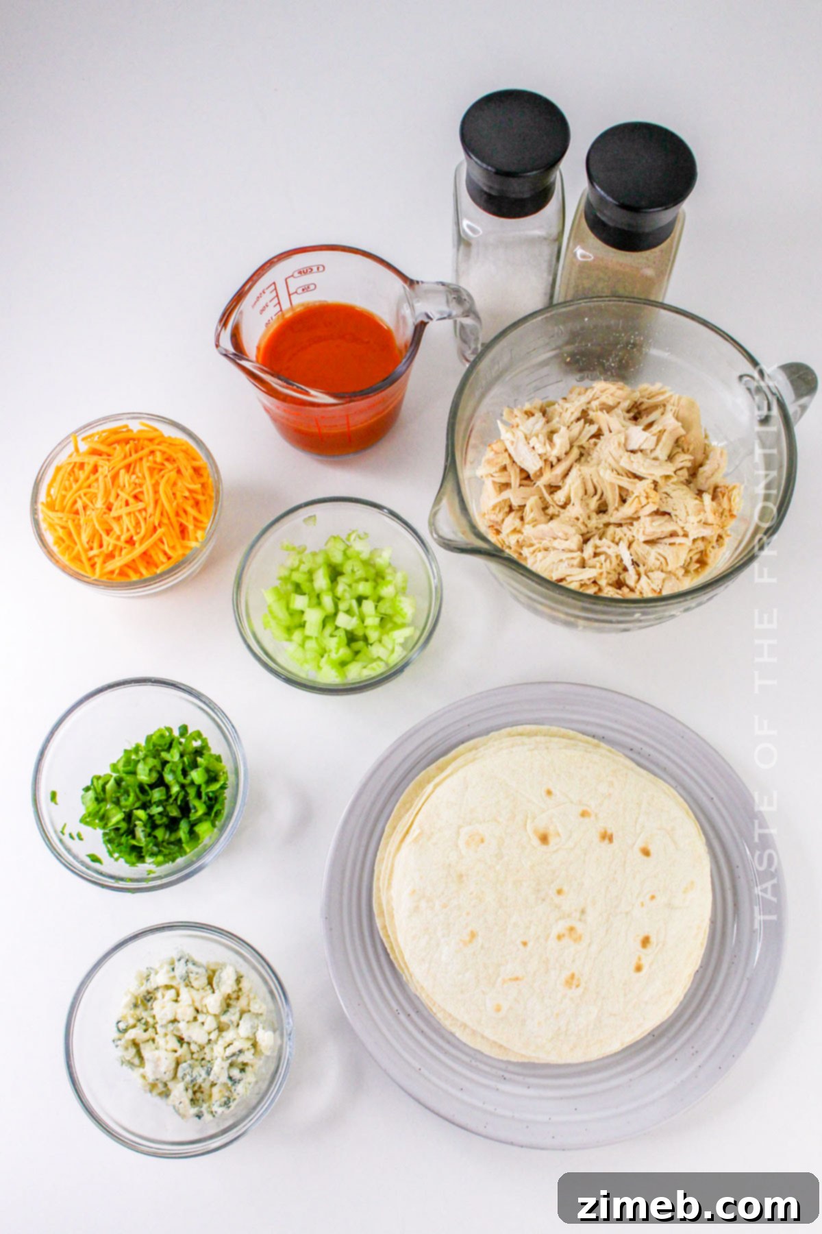 Crispy Buffalo Chicken Taquitos 4 Ingredients laid out for Buffalo Chicken Taquitos