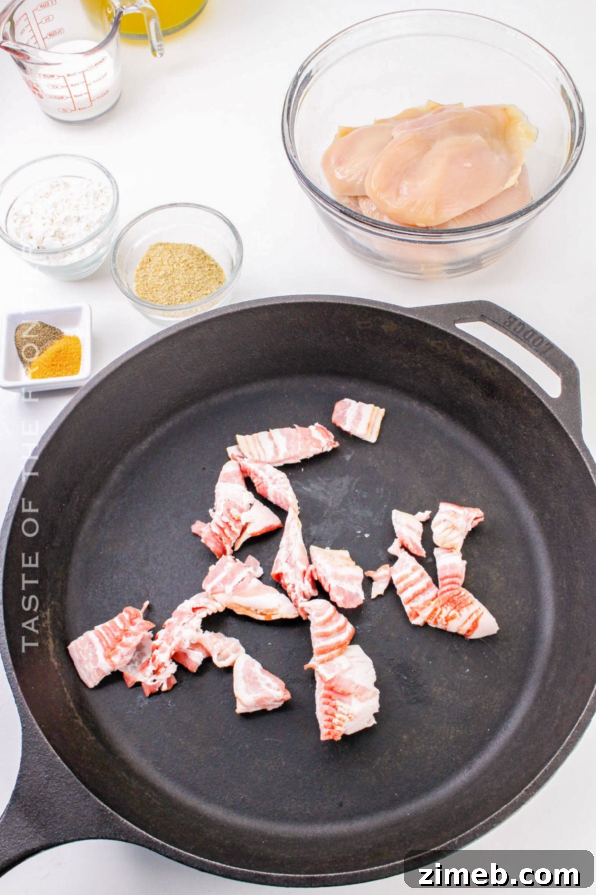 cooking the bacon pieces in the skillet for smothered chicken