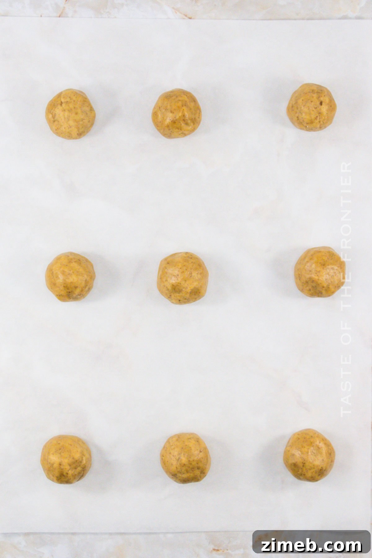 Tiramisu cookie dough balls ready to bake.