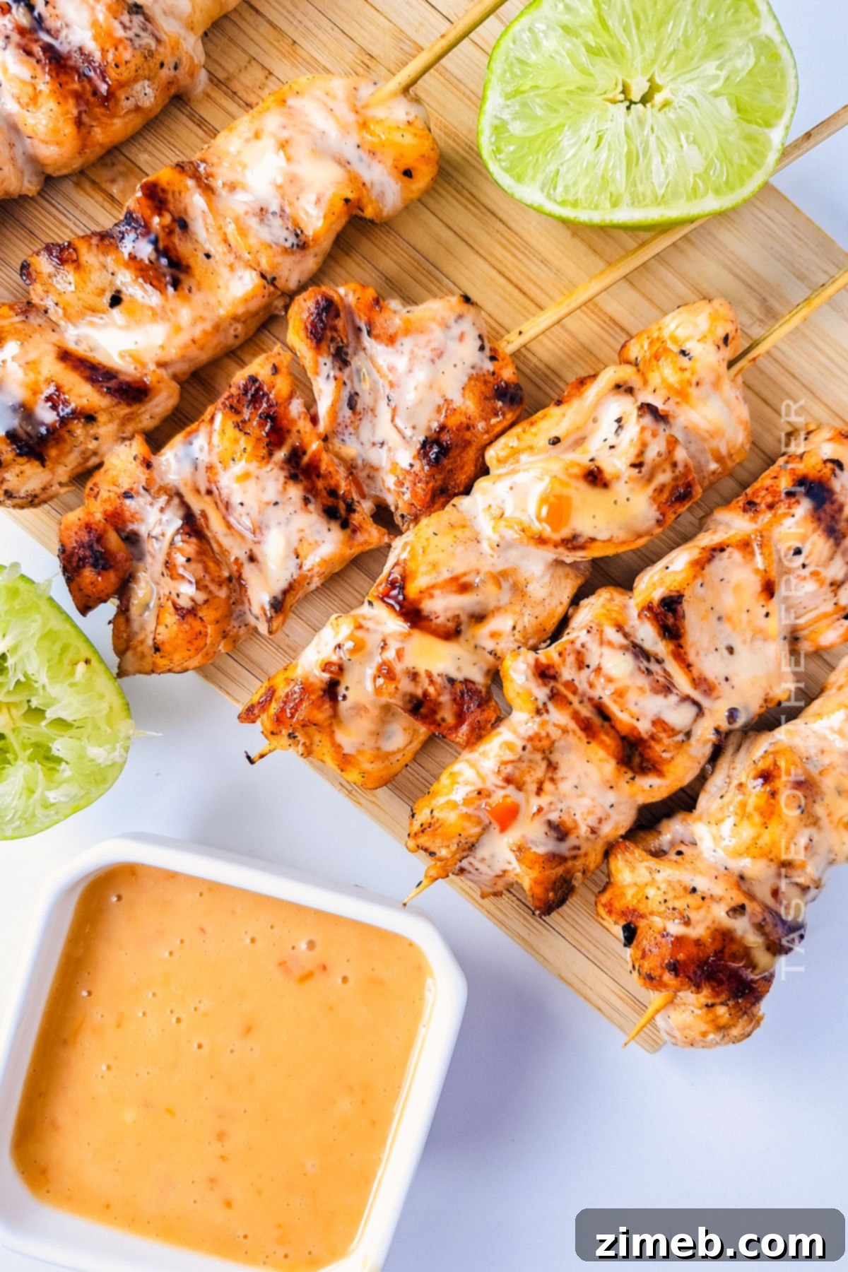 Chicken Skewers with Bang Bang Sauce 8 Close-up of perfectly grilled Bang Bang Chicken Skewers on a platter, garnished, and ready to serve.