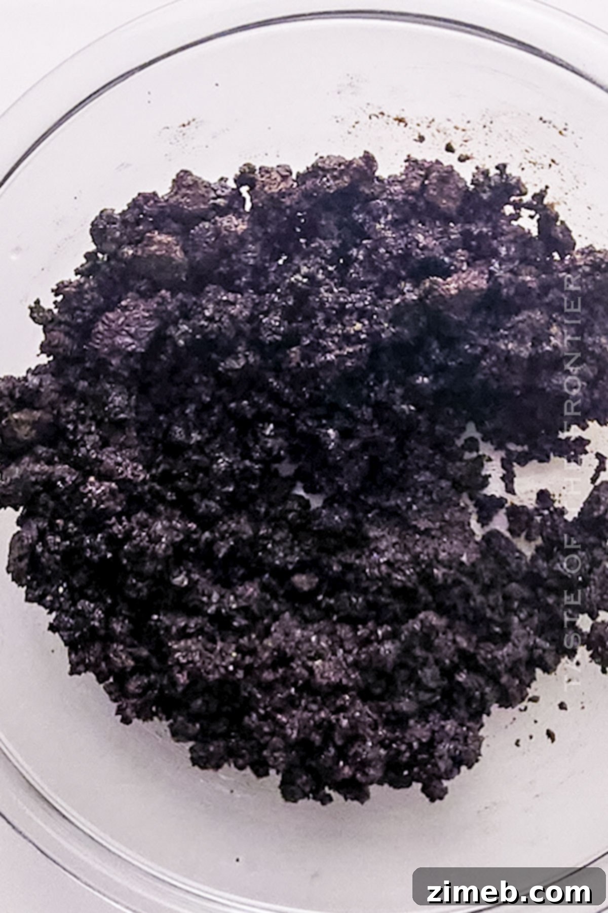 A perfectly pressed Oreo crust ready for the Snickers cheesecake filling.