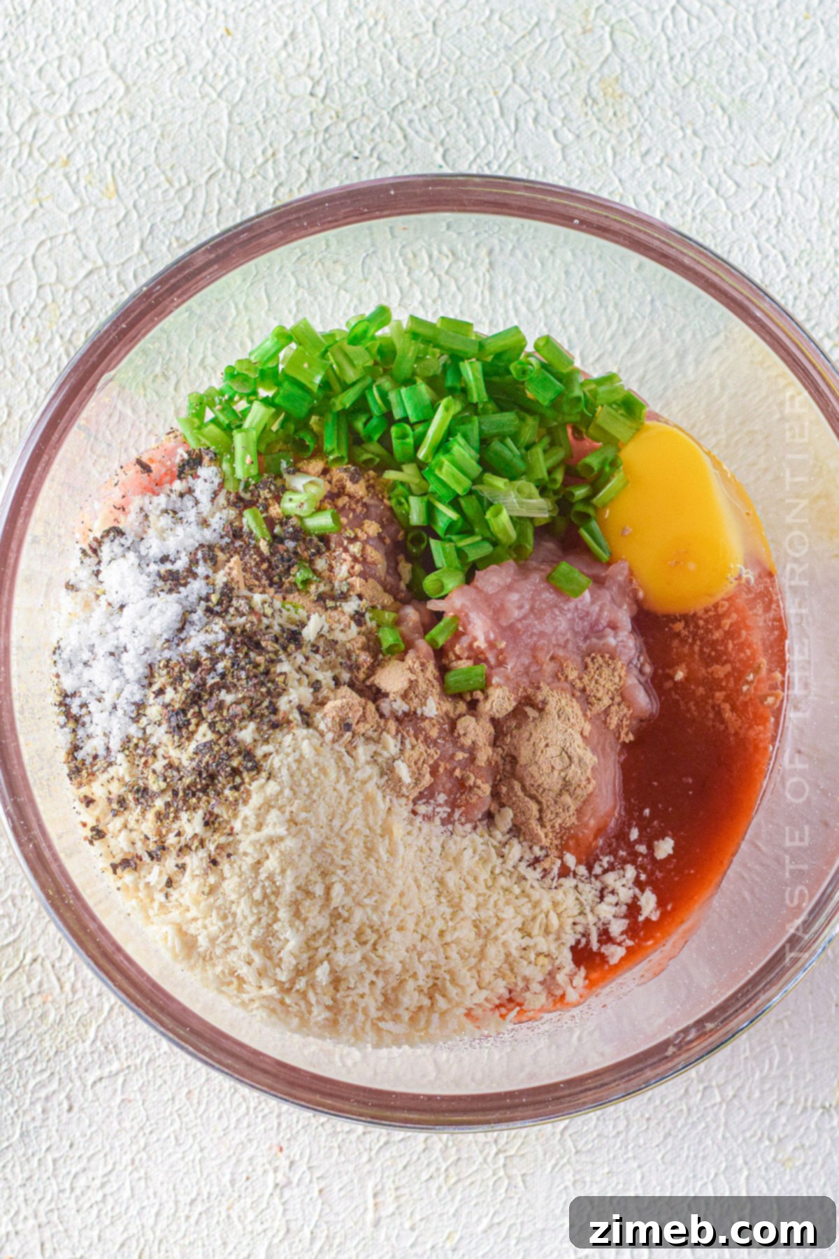 mixing the ground chicken