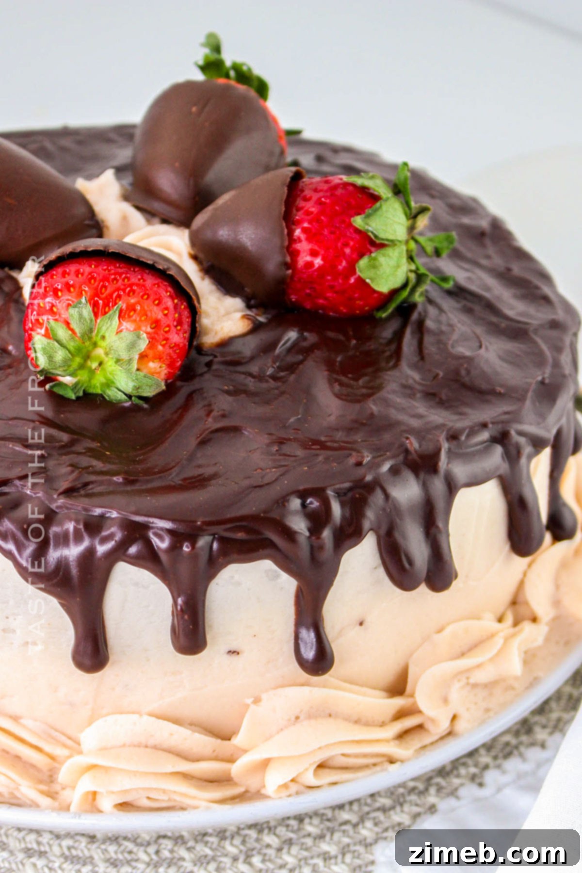 Two-layer chocolate cake with strawberry filling ready for frosting