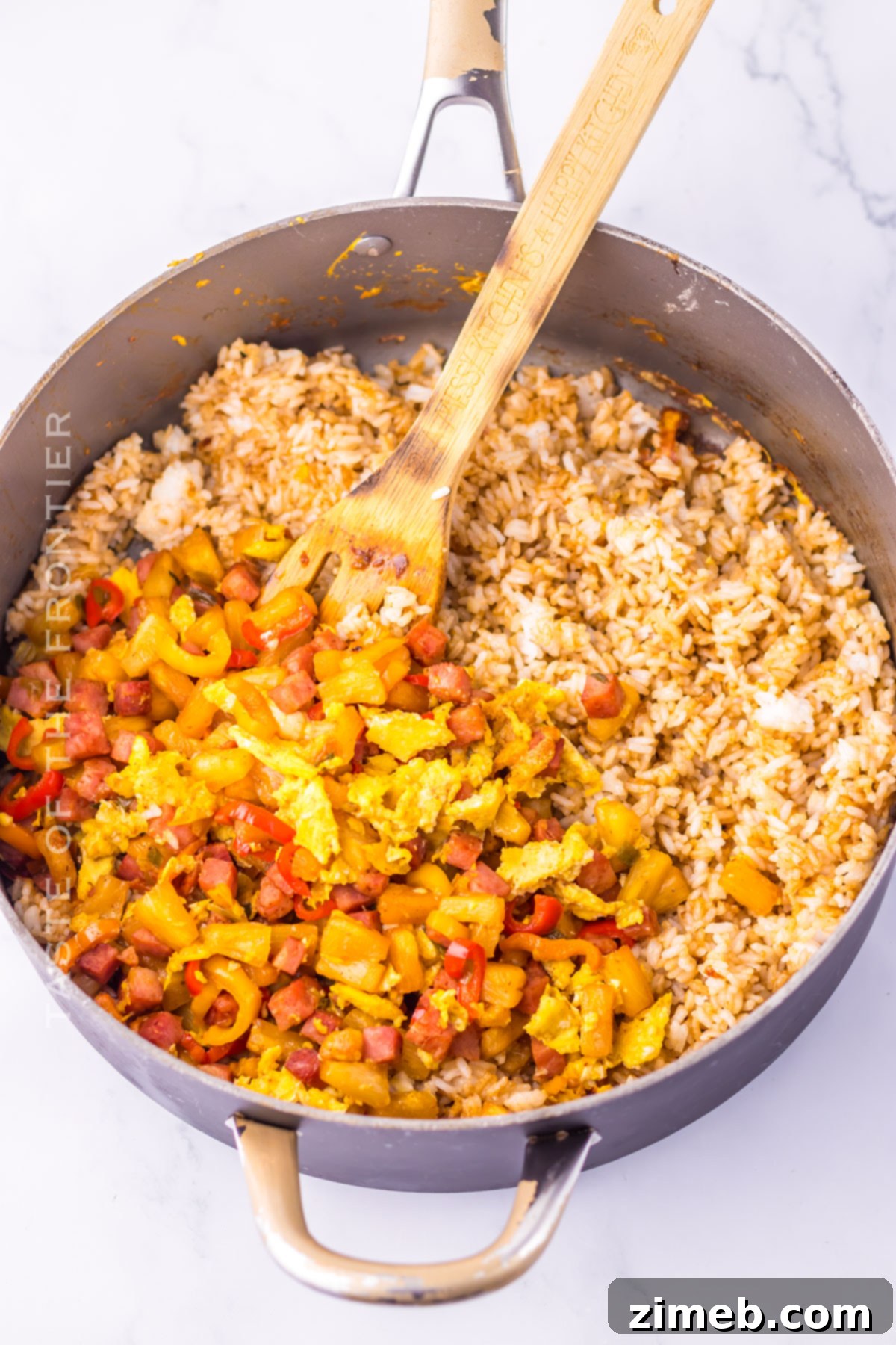 Aloha Fried Rice Bowl 5 Frying rice and ingredients in a large skillet