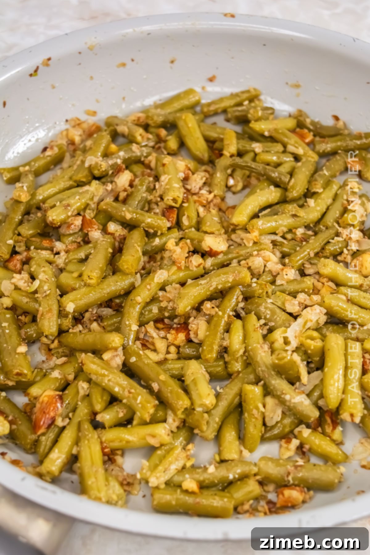 Convenient Green Beans 13 Making canned veggies in a skillet, close up