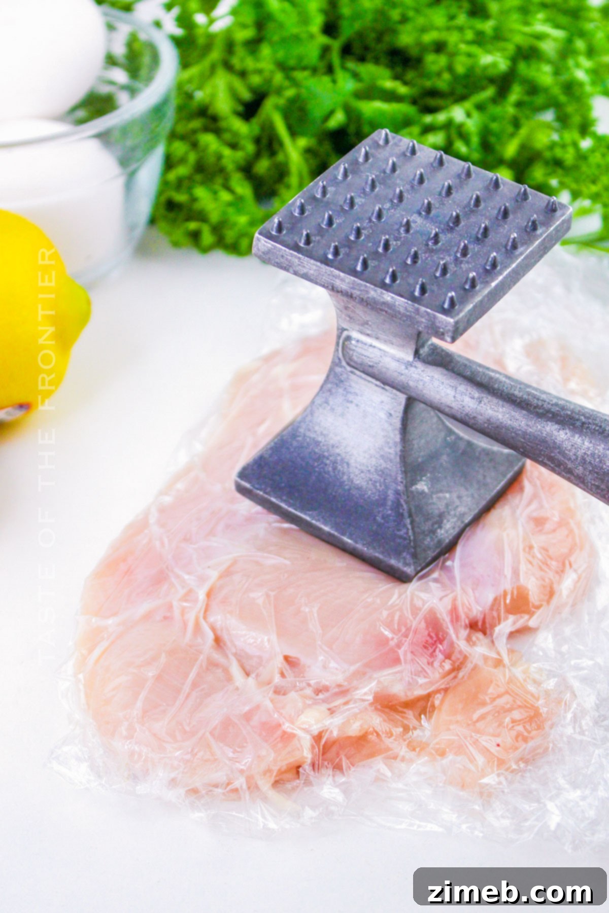 Pounding chicken breasts to flatten into cutlets