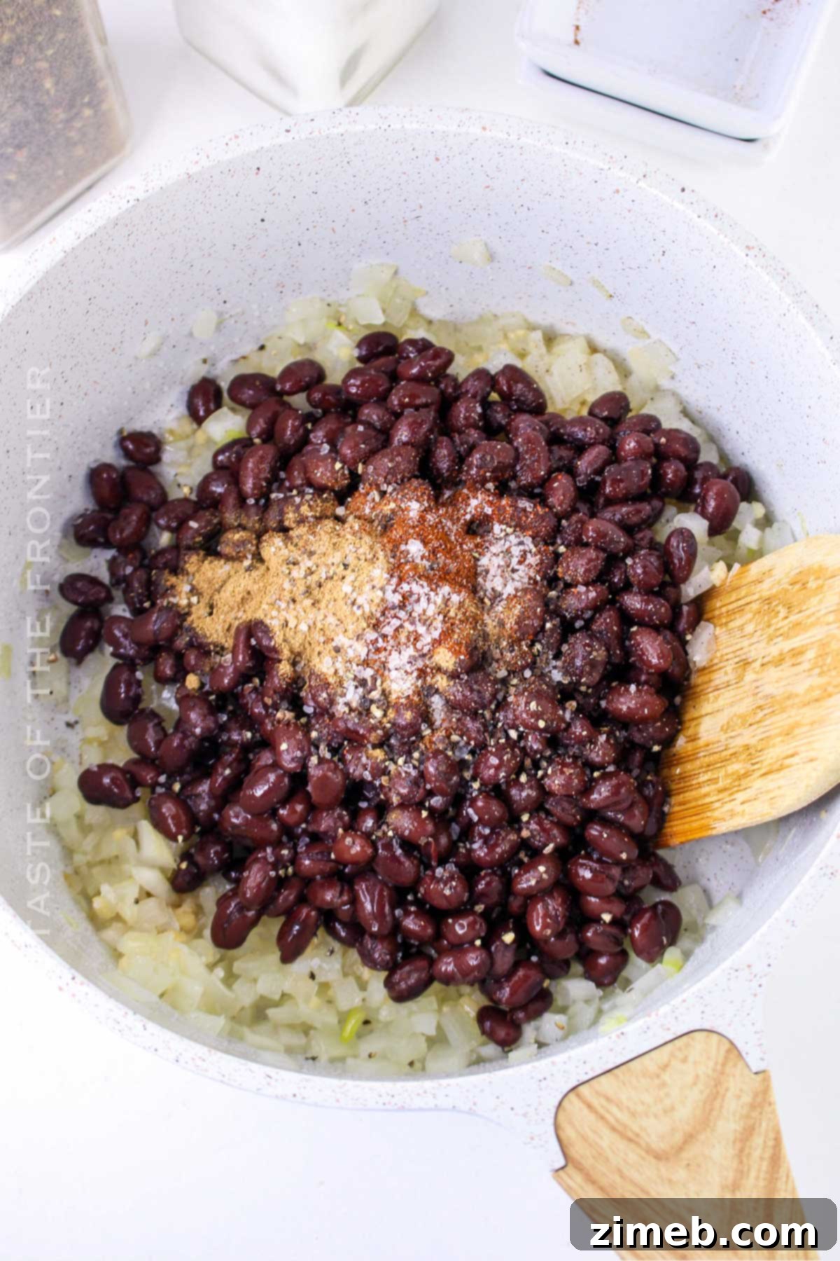 Ultimate Black Bean Tostadas 7 Flavorful black bean mixture cooking in a skillet