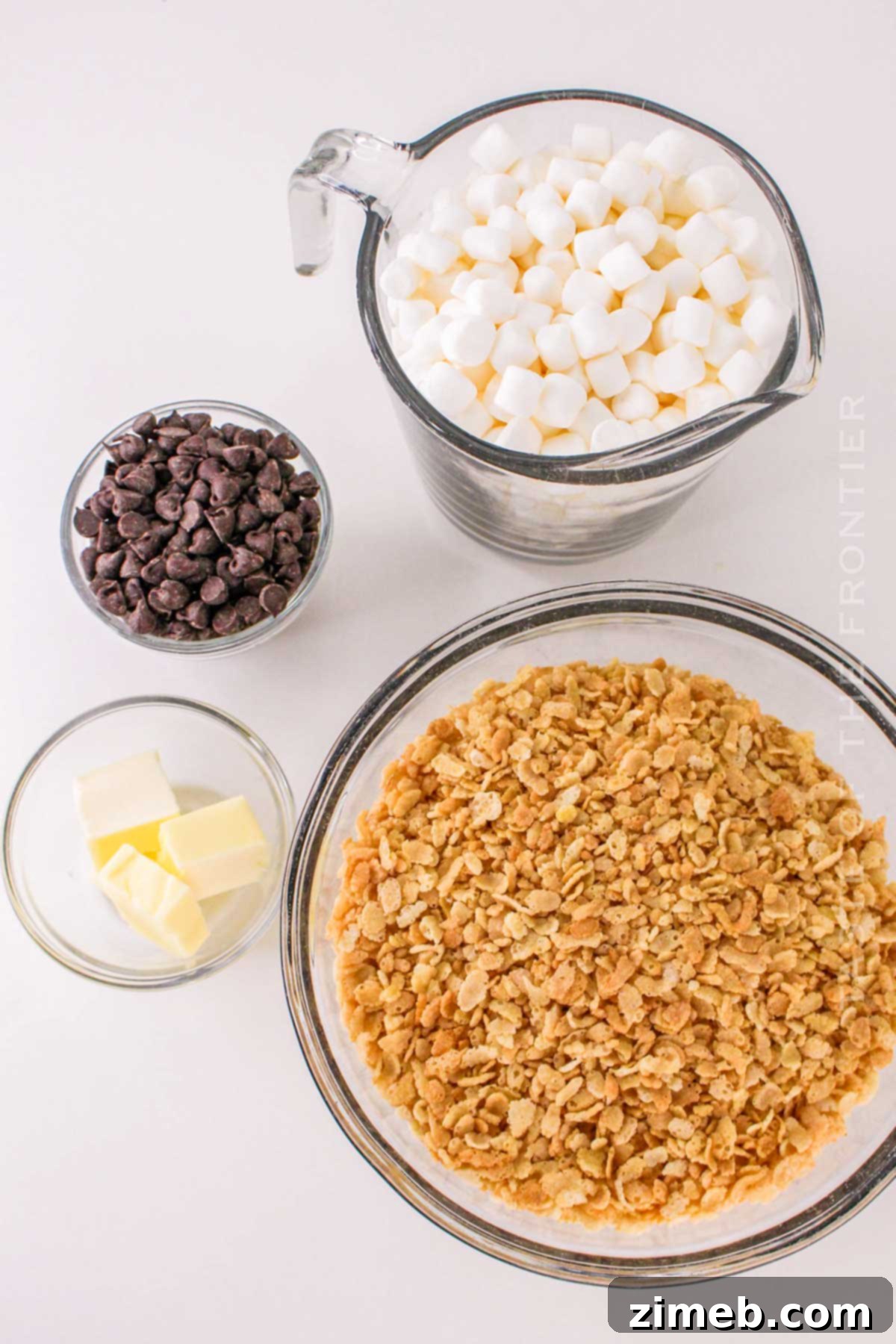 Chocolate Crispy Dream Bars 4 Ingredients for Chocolate Rice Krispies Squares: butter, marshmallows, chocolate chips, and Rice Krispies cereal.