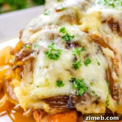 Crockpot French Onion Chicken served in a bowl, showing tender chicken in a rich onion sauce.