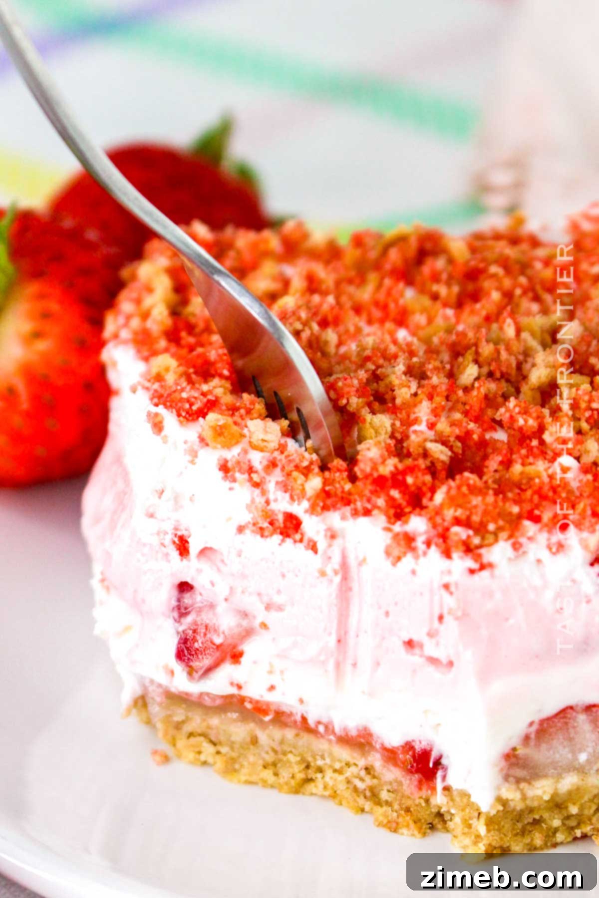 Crimson Indulgence 15 Full view of the finished Strawberry Delight dessert in a square pan, garnished with fresh strawberries, ready for serving.