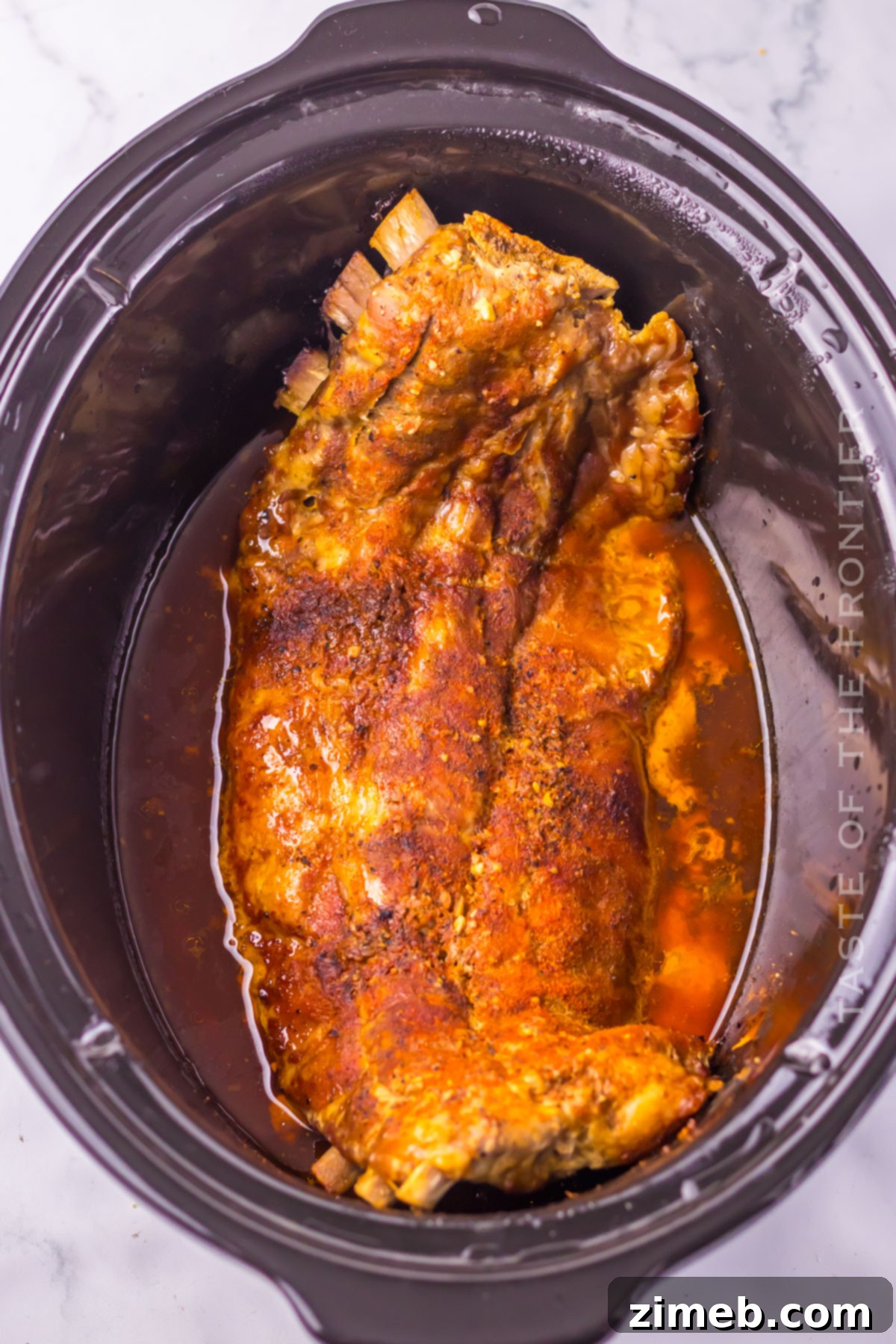 Effortless Island Ribs 7 Cooked Hawaiian Ribs in a crockpot, ready to serve.