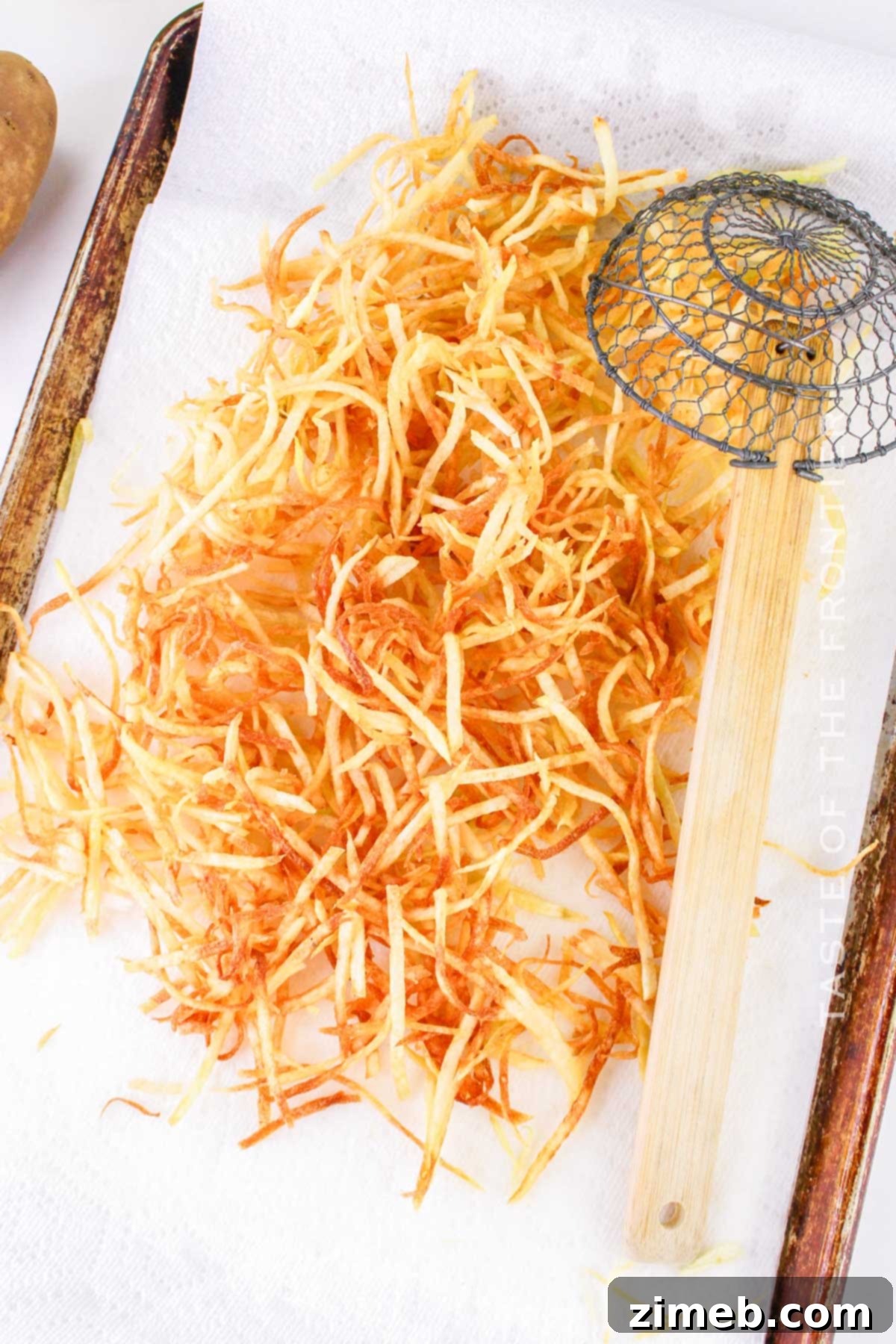 Making the fries, showing the double-frying process
