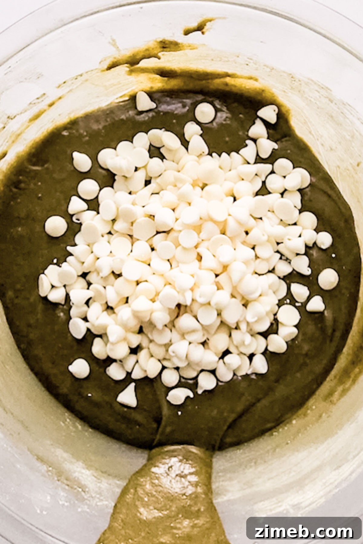 Matcha Brownies: A Green Twist on a Classic Treat 6 Matcha brownie batter being poured into a pan