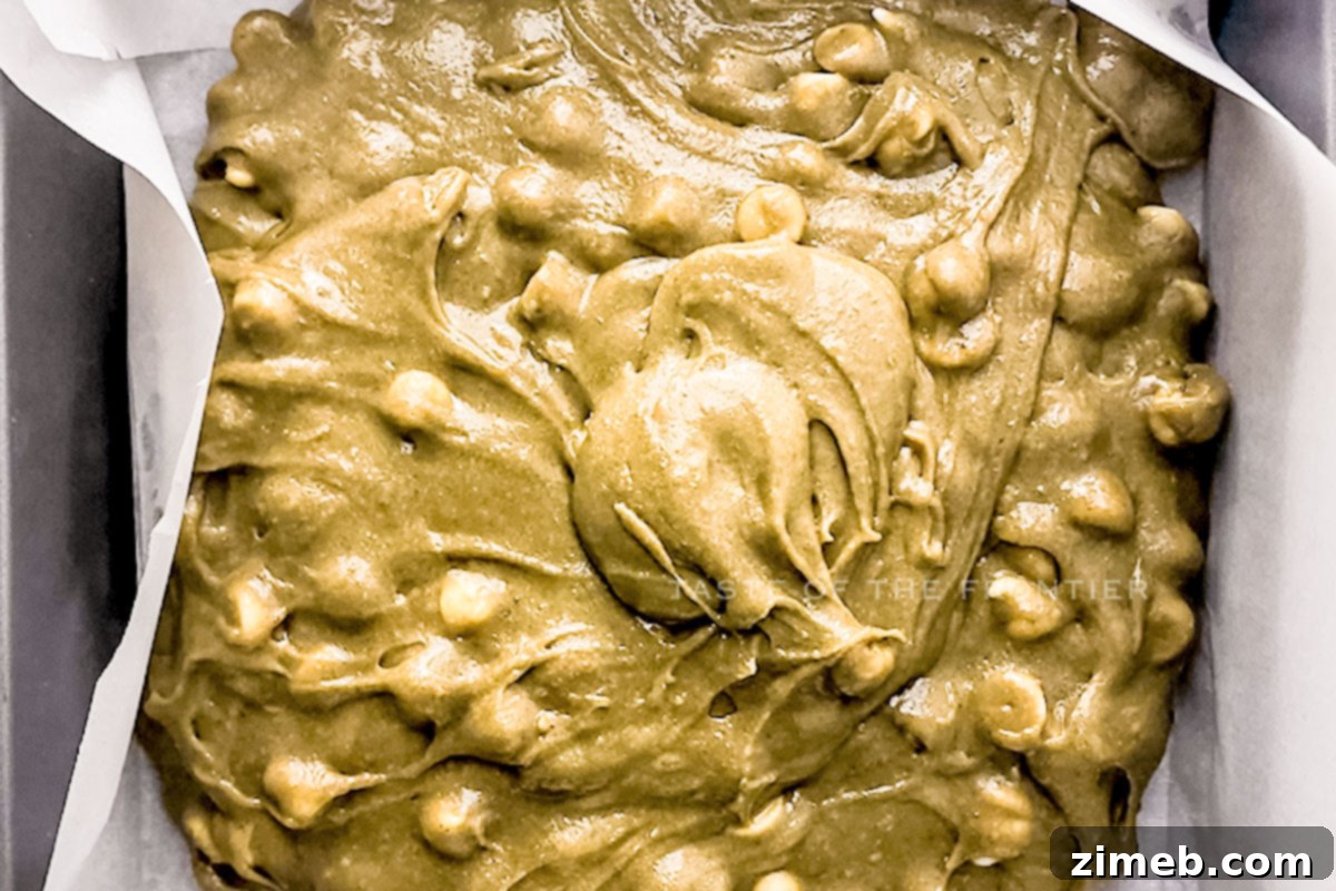 Matcha Brownies: A Green Twist on a Classic Treat 7 Close-up of baked matcha brownies being prepared for cutting