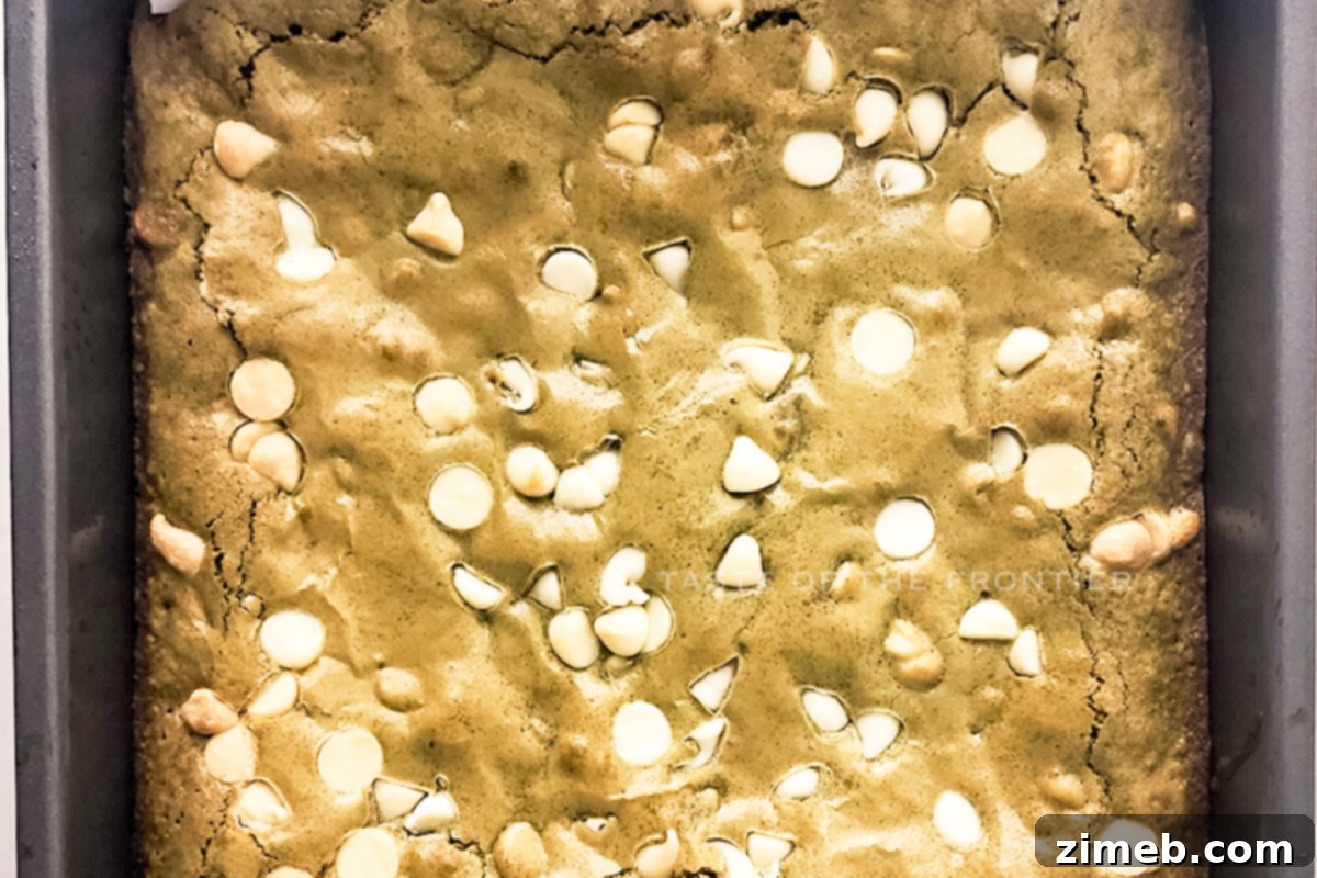 Matcha Brownies: A Green Twist on a Classic Treat 8 Matcha brownies with white chocolate chips, sliced and ready to serve