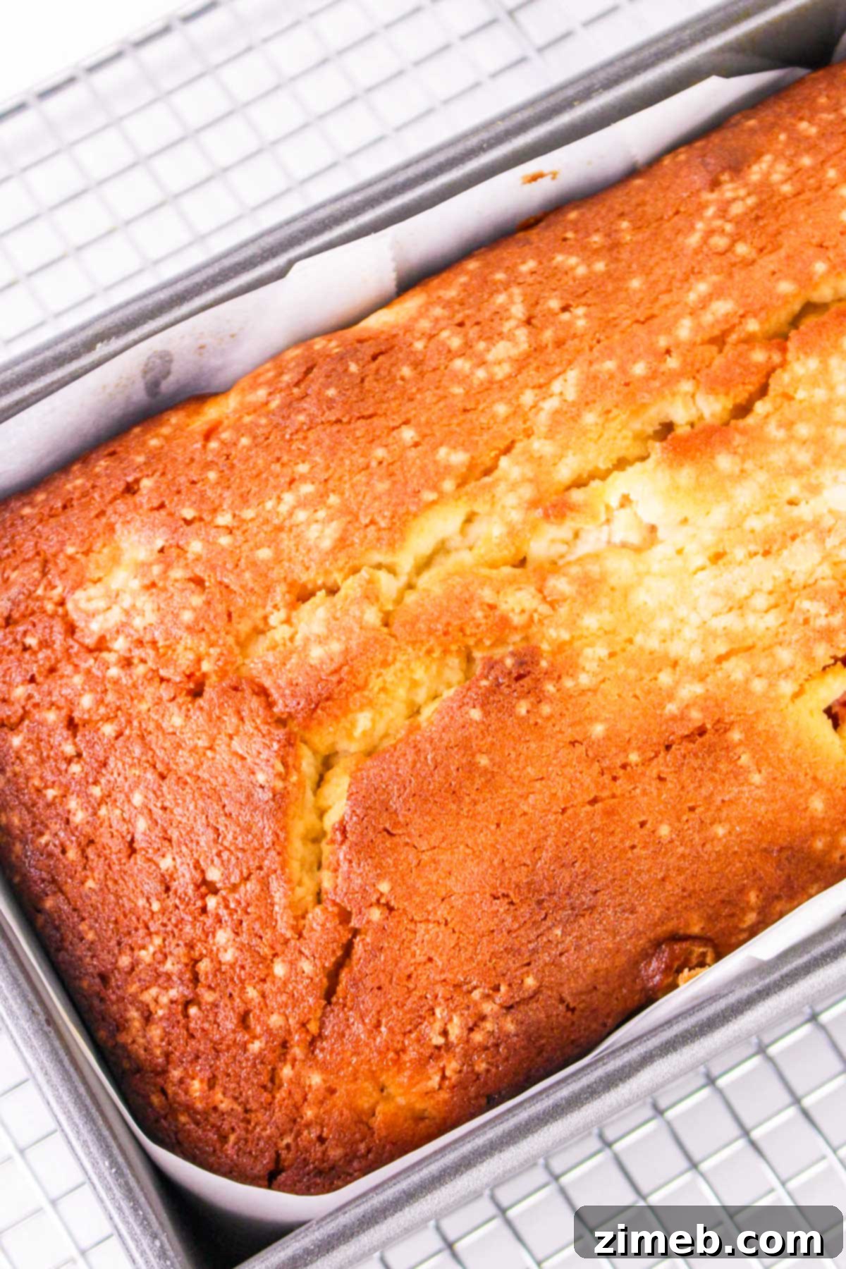 Fully baked Strawberry Lemonade Pound Cake on a wire rack