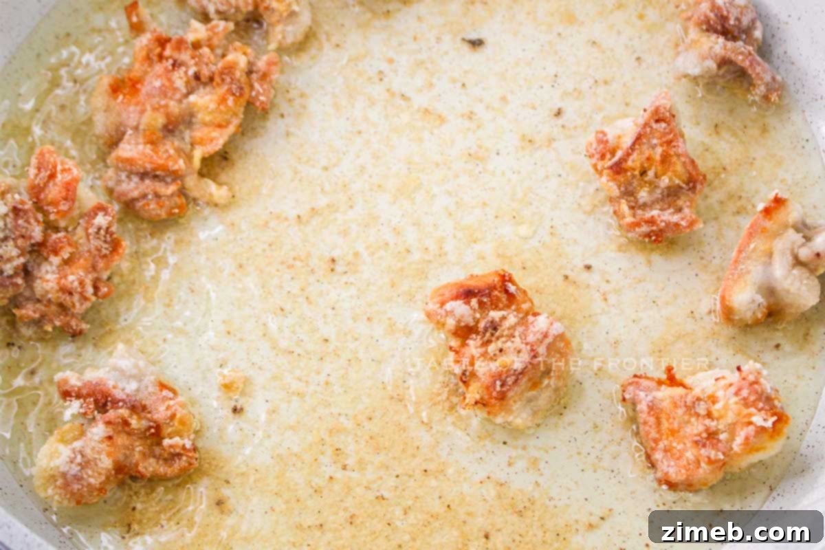 Sweet Heat Thai Chicken 6 Sautéing coated chicken in a skillet for Thai Sweet Chili Chicken
