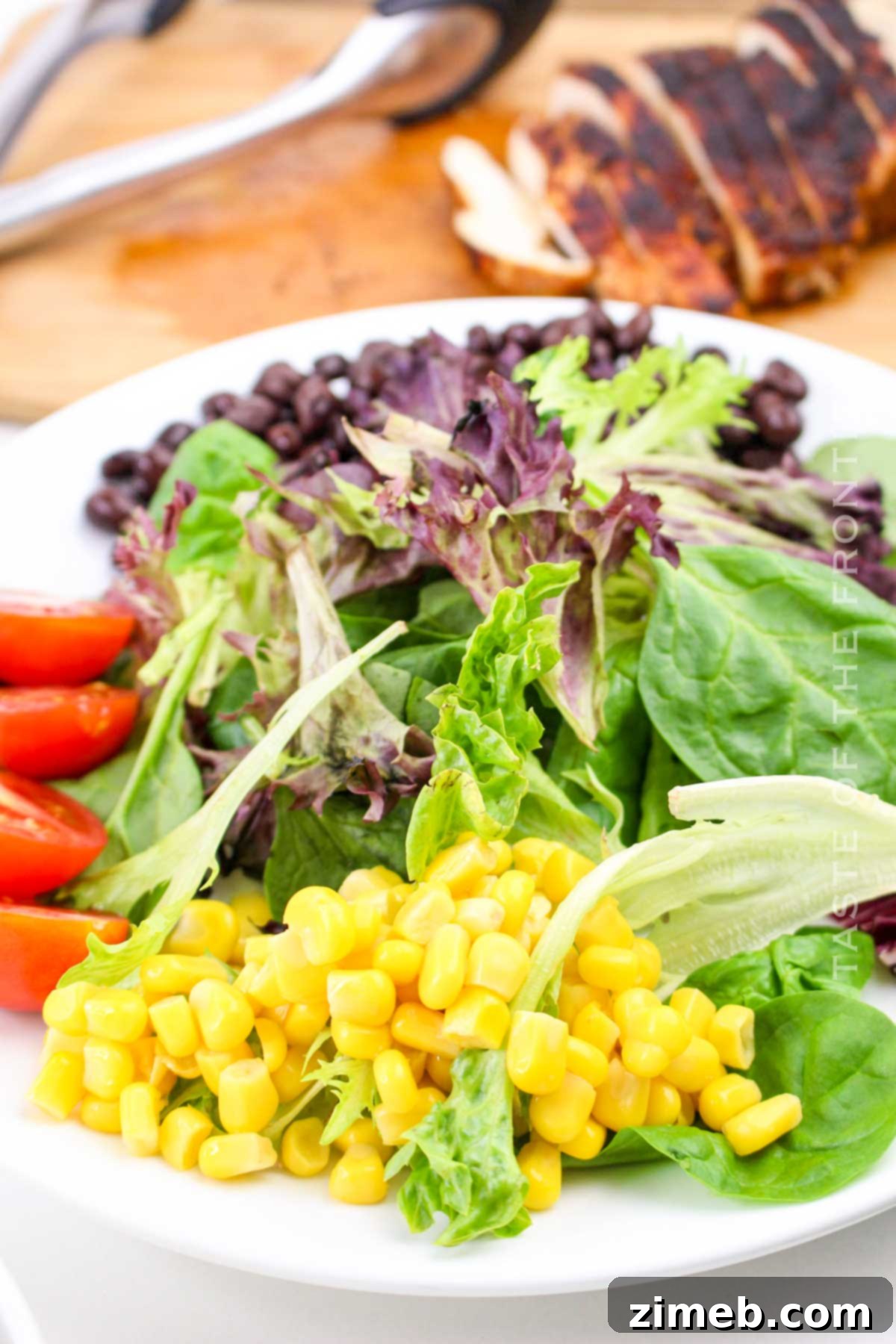 Assembling Southwest Chicken Salad ingredients in a bowl