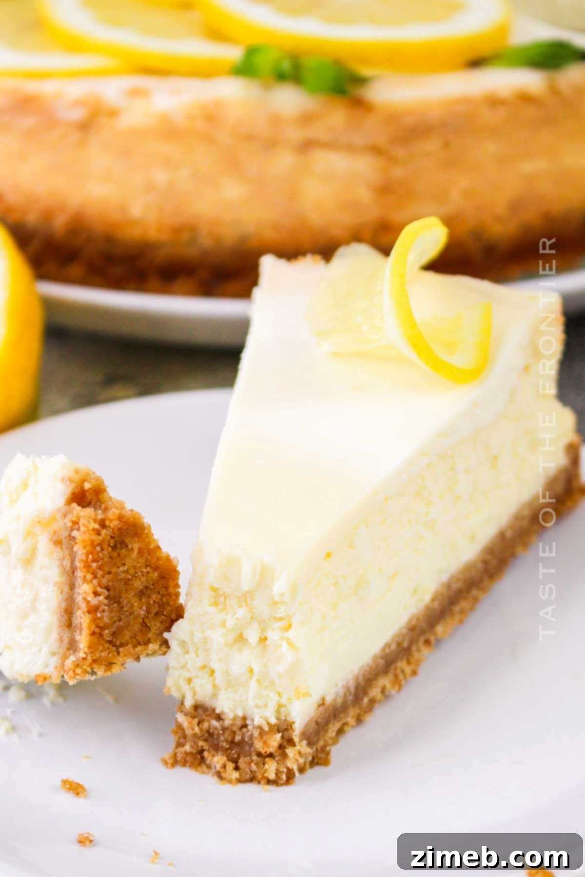 Lemon Cheesecake - a creamy, tangy dessert with a buttery graham cracker crust and rich lemon filling.
